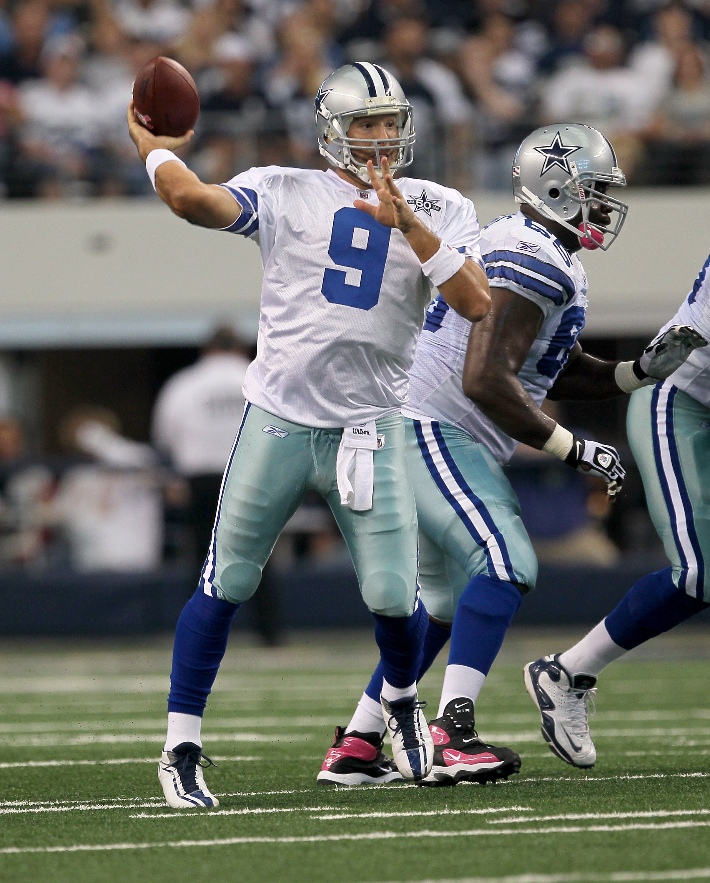 ARLINGTON, TX - OCTOBER 10:  Quarterback Tony Romo #9 of the Dallas Cowboys throws a pass against the Tennessee Titans at Cowboys Stadium on October 10, 2010 in Arlington, Texas. (Photo by Stephen Dunn/Getty Images)