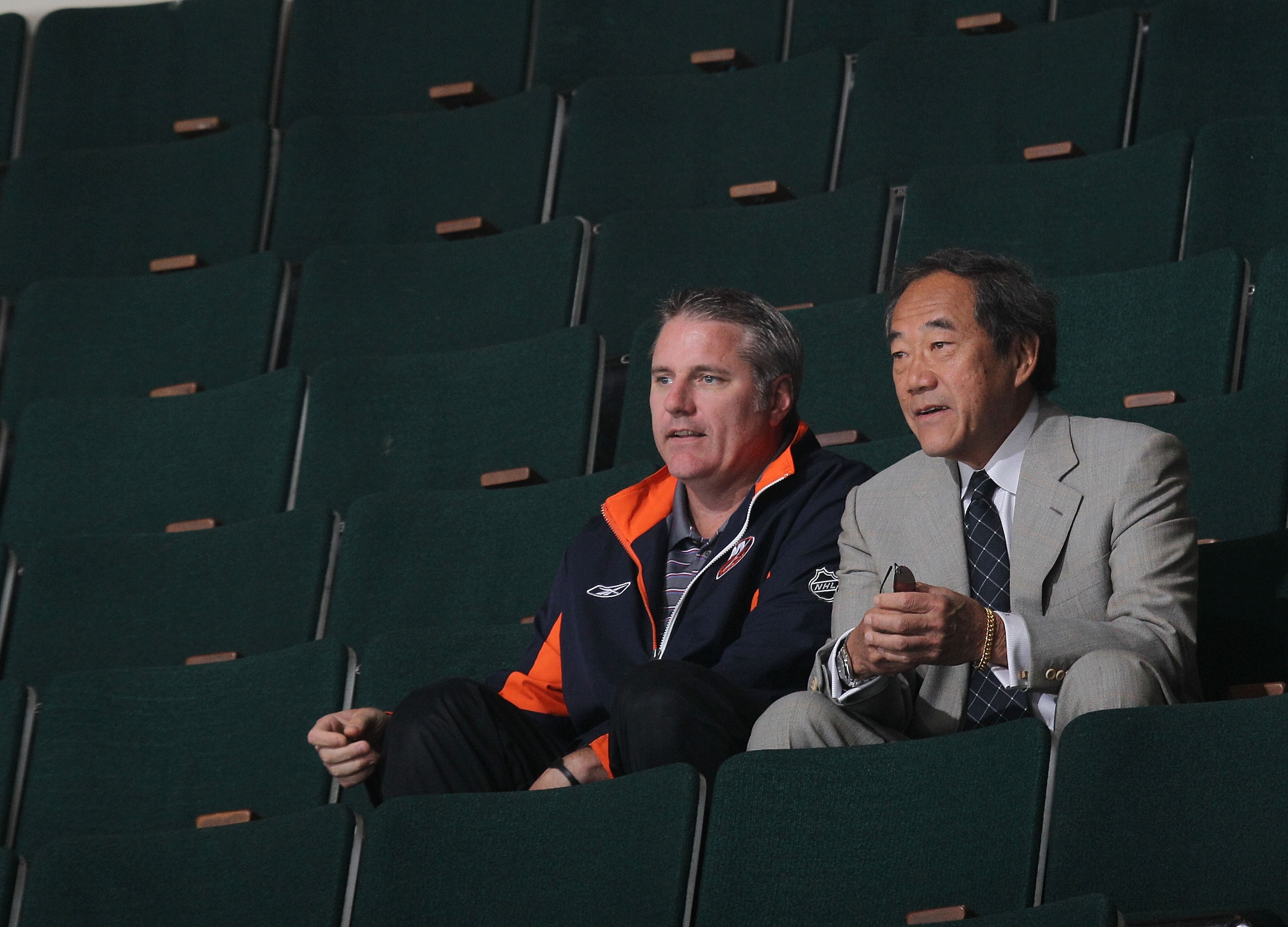 UNIONDALE, NY - JULY 07: General Manager Garth Snow and team owner Charles Wang watch the New York Islanders rookie camp at Nassau Veterans Memorial Coliseum on July 7, 2010 in Uniondale, New York. (Photo by Bruce Bennett/Getty Images)