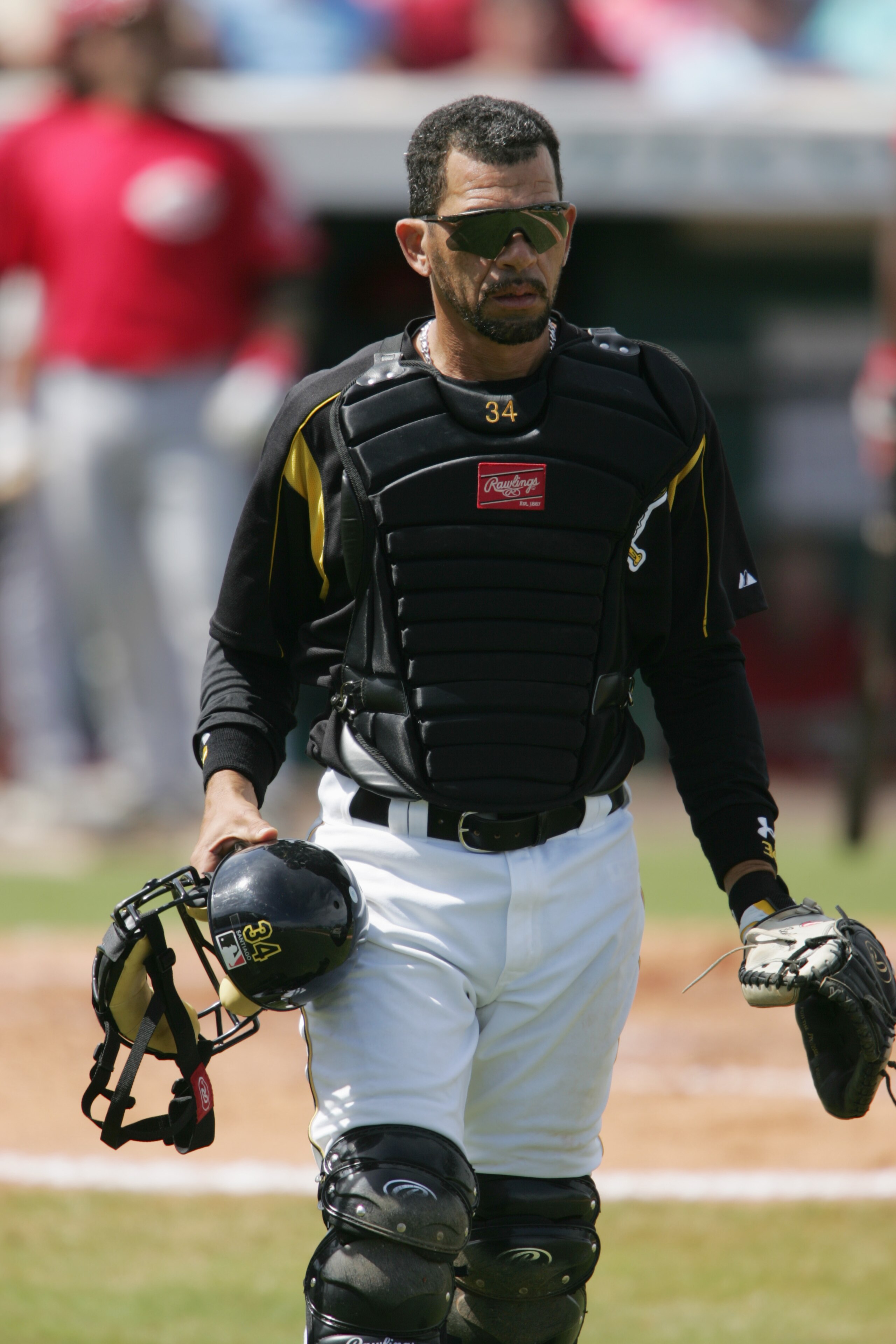 BRADENTON, FL - MARCH 8:  Catcher Benito Santiago #34 of the Pittsburgh Pirates looks on during a Spring Training game against the Cincinnati Reds on March 8, 2005 at McKechnie Field in Bradenton, Florida.  The Reds defeated the Pirates' 10-4.  (Photo by