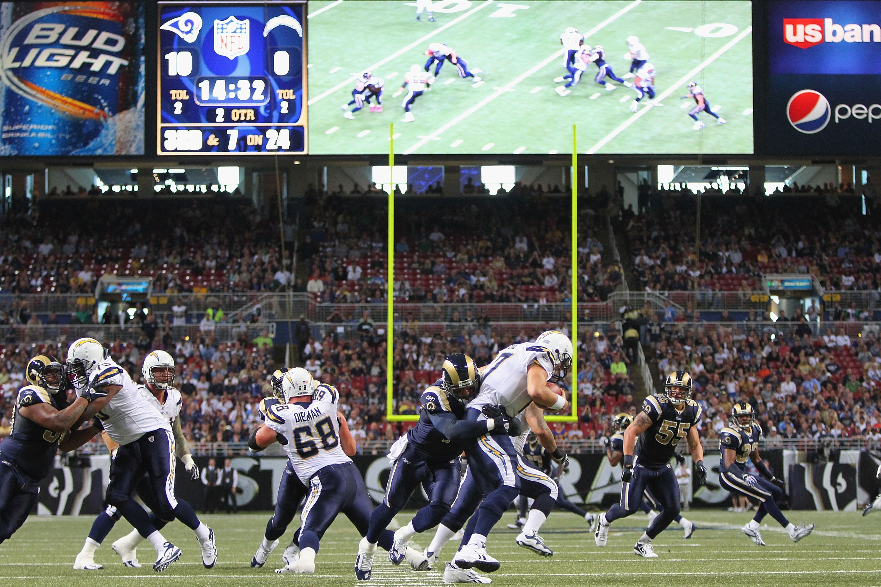ST. LOUIS - OCTOBER 17: Chris Long #72 of the St. Louis Rams sacks Philip Rivers #17 of the San Diego Chargers at the Edward Jones Dome on October 17, 2010 in St. Louis, Missouri.  The Rams beat the Chargers 20-17.  (Photo by Dilip Vishwanat/Getty Images)