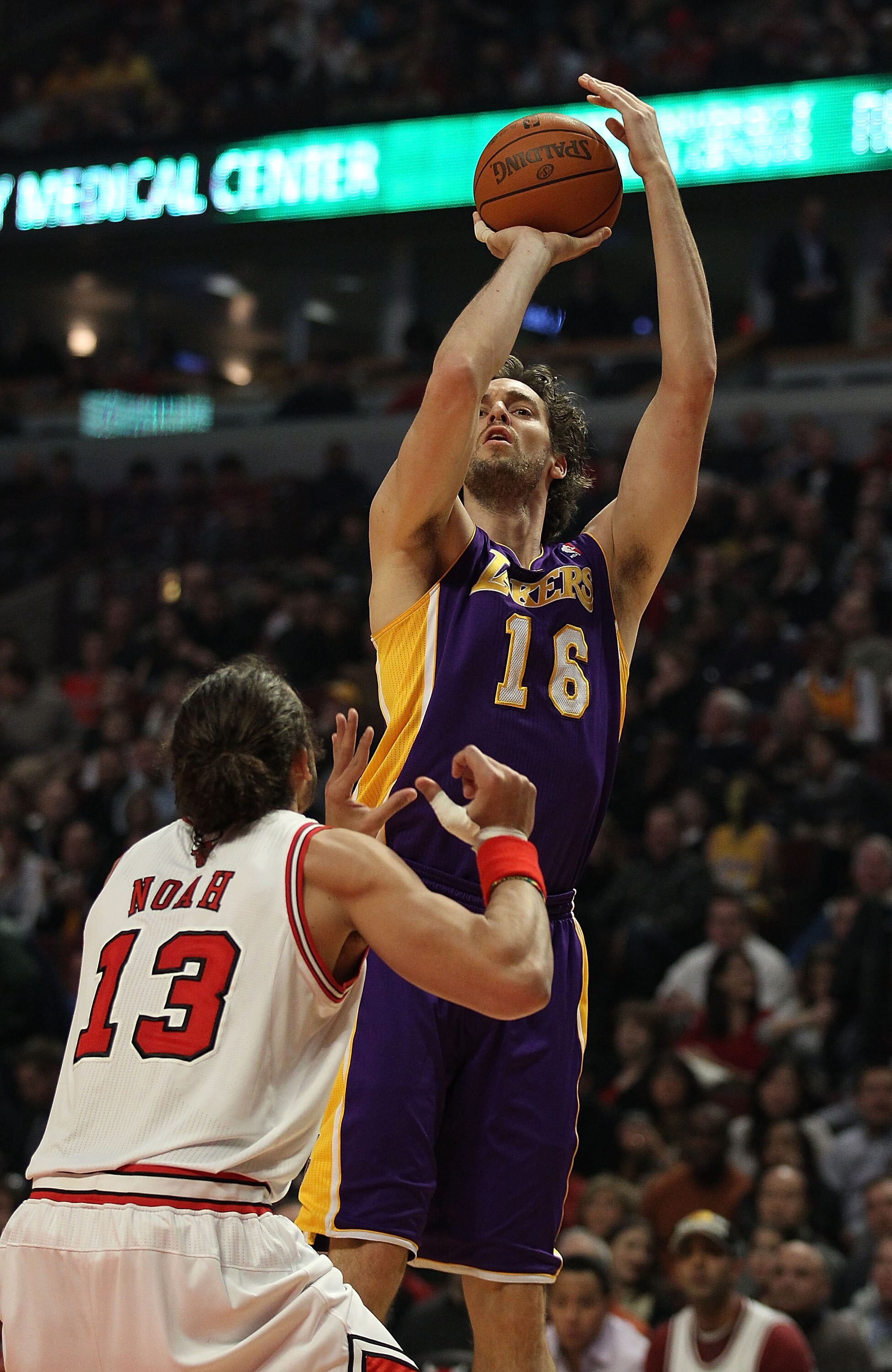 CHICAGO, IL - DECEMBER 10: Pau Gasol #16 of the Los Angeles Lakers puts up a shot over Joakim Noah #13 of the Chicago Bulls at the United Center on December 10, 2010 in Chicago, Illinois. The Bulls defeated the Lakers 88-84. NOTE TO USER: User expressly a