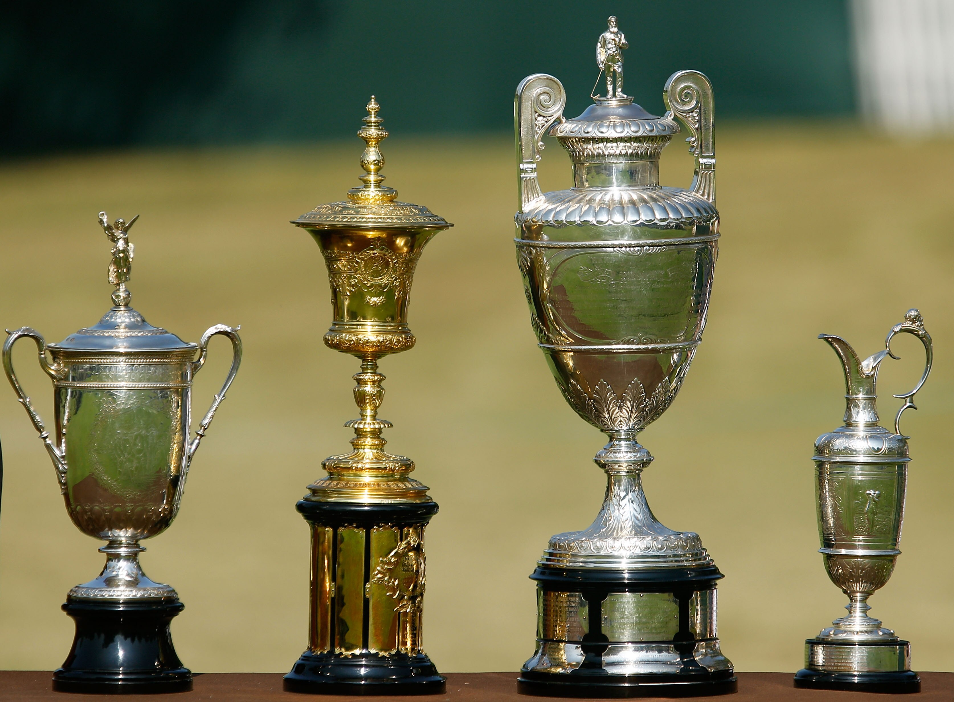 ATLANTA - SEPTEMBER 23:  (L-R) The U.S. Open trophy, U.S. Amateur trophy, British Amateur trophy and British Open trophy are seen in honor of Bobby Jones' 1930 Grand Slam during the opening ceremony prior to the first round of THE TOUR Championship presen