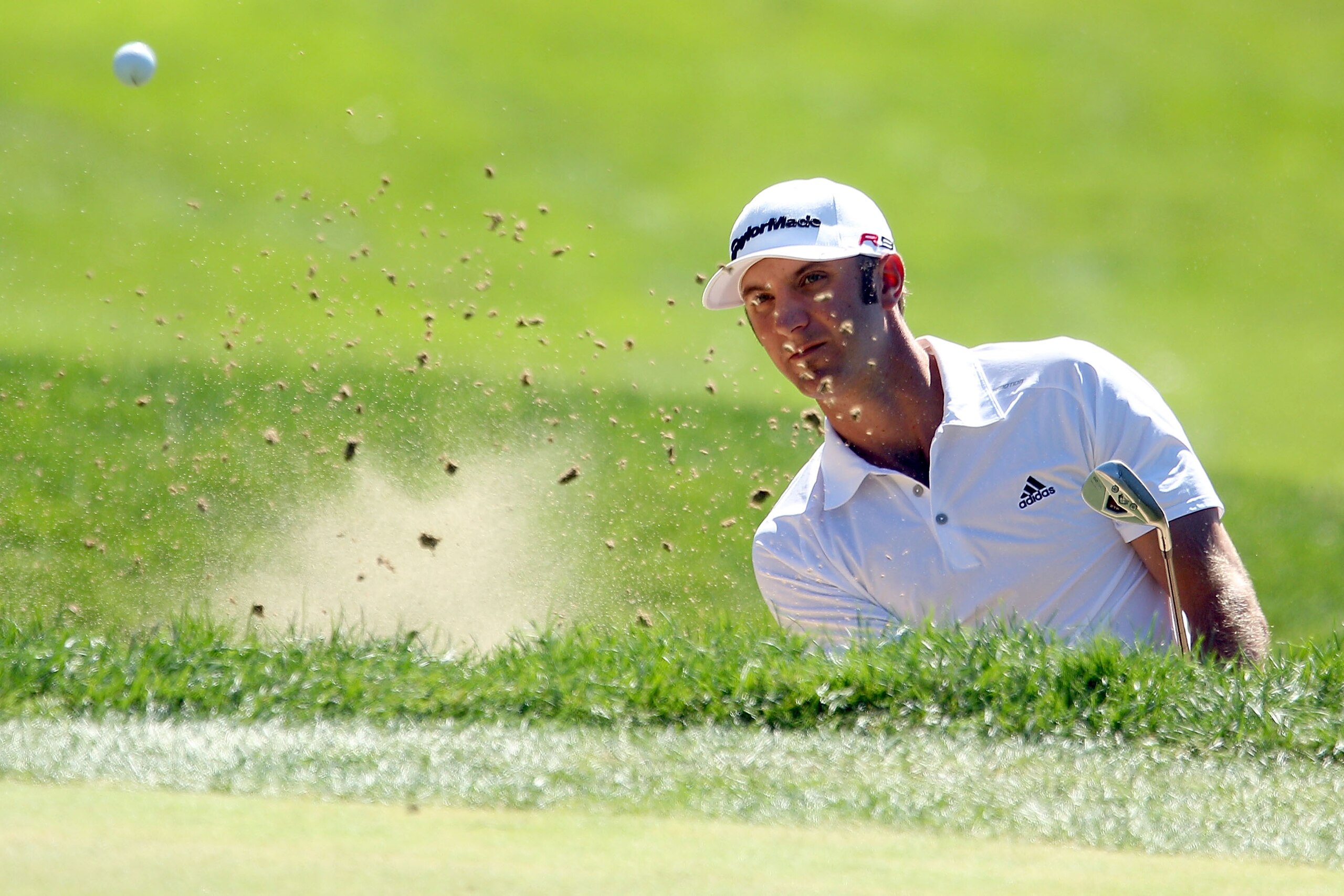 LEMONT, IL - SEPTEMBER 12:  Dustin Johnson hits out of a bunker on the sixth hole during the final round of the BMW Championship at Cog Hill Golf & Country Club on September 12, 2010 in Lemont, Illinois.  (Photo by Scott Halleran/Getty Images)
