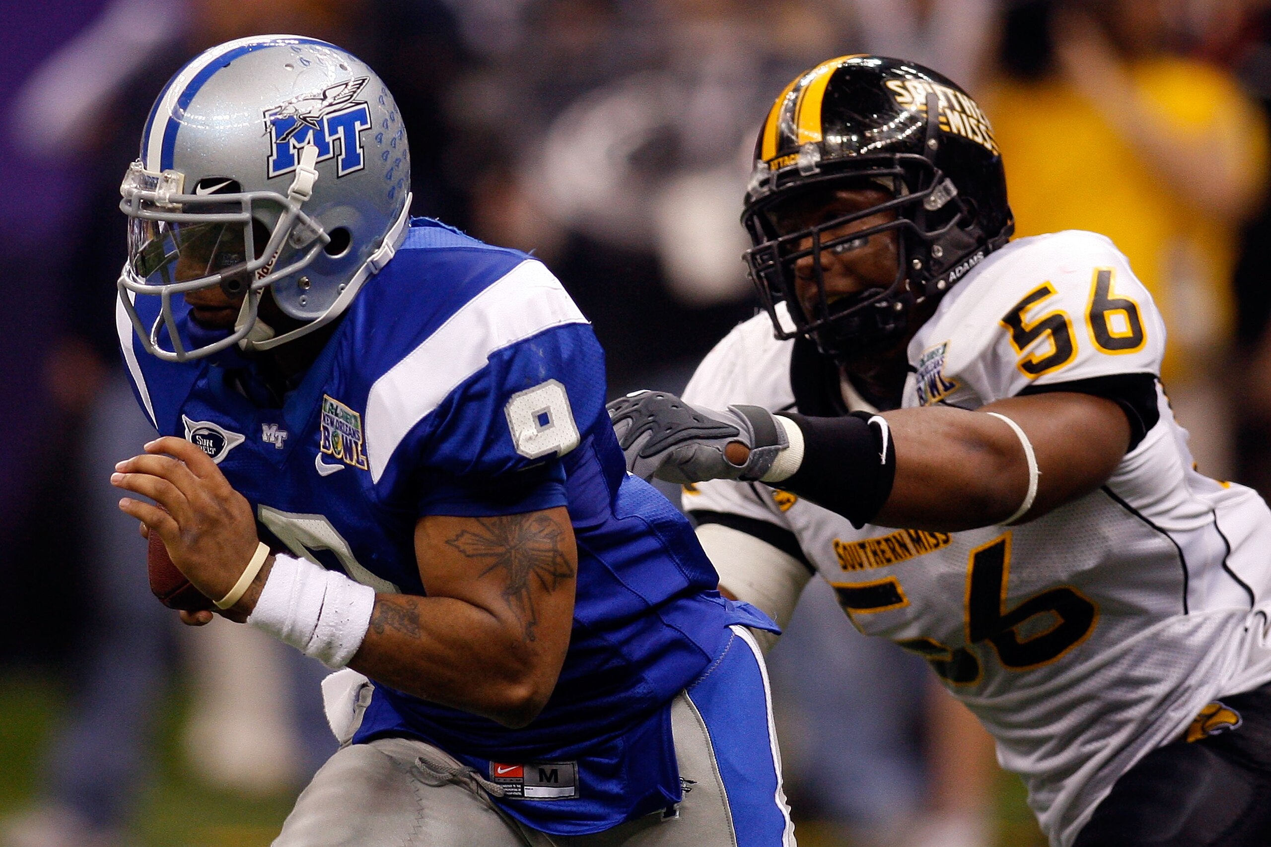 NEW ORLEANS - DECEMBER 20:  Dwight Dasher #9 of the Middle Tennessee Blue Raiders runs past Ronnie Thornton #56 of the Southern Miss Golden Eagles during the R+L Carriers New Orleans Bowl at the Louisiana Superdome on December 20, 2009 in New Orleans, Lou