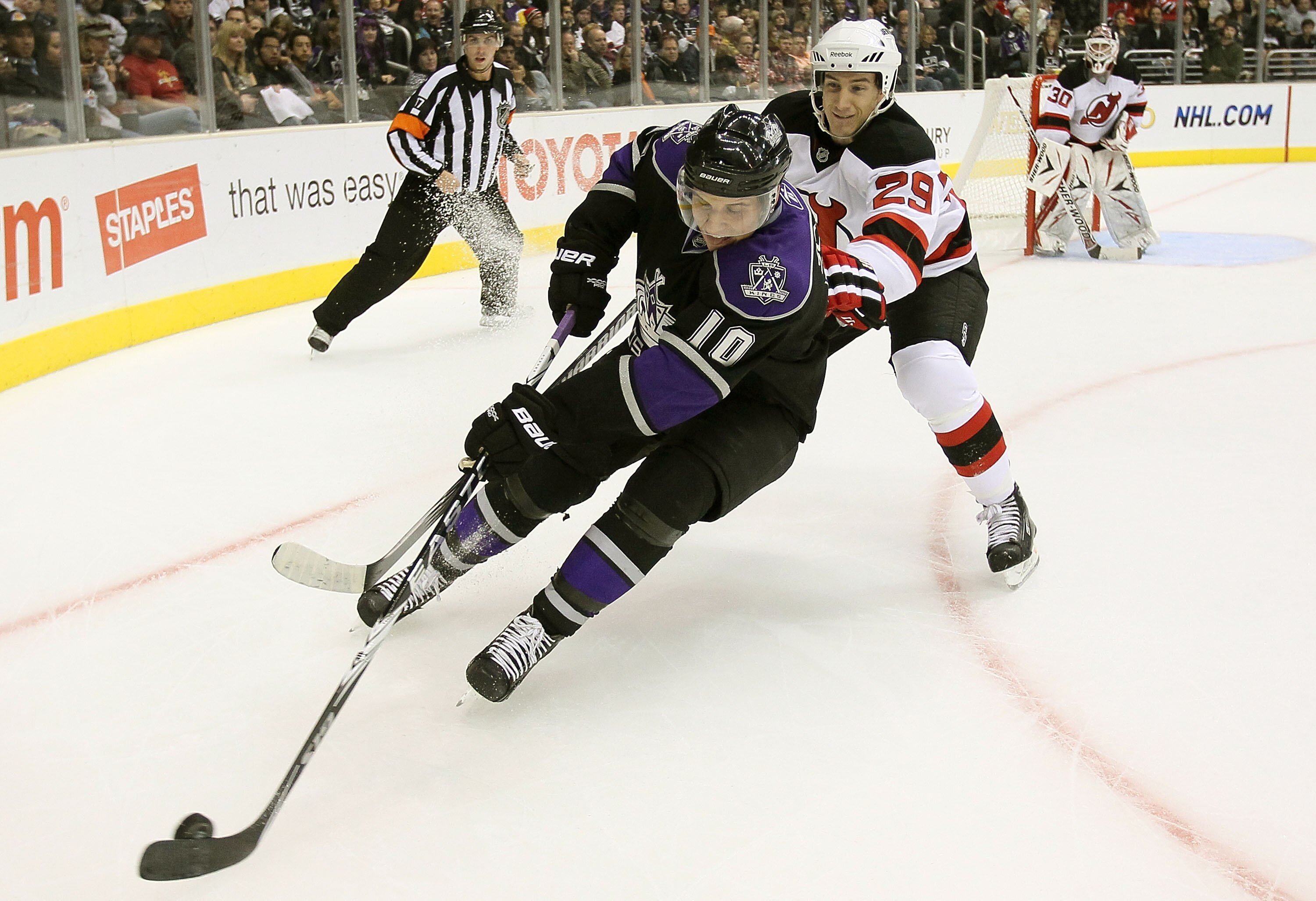LOS ANGELES, CA - OCTOBER 30:  Brayden Schenn #10 of the Los Angeles Kings is pursued by Olivier Magnan-Grenier #29 of the New Jersey Devils at Staples Center on October 30, 2010 in Los Angeles, California.  (Photo by Jeff Gross/Getty Images)