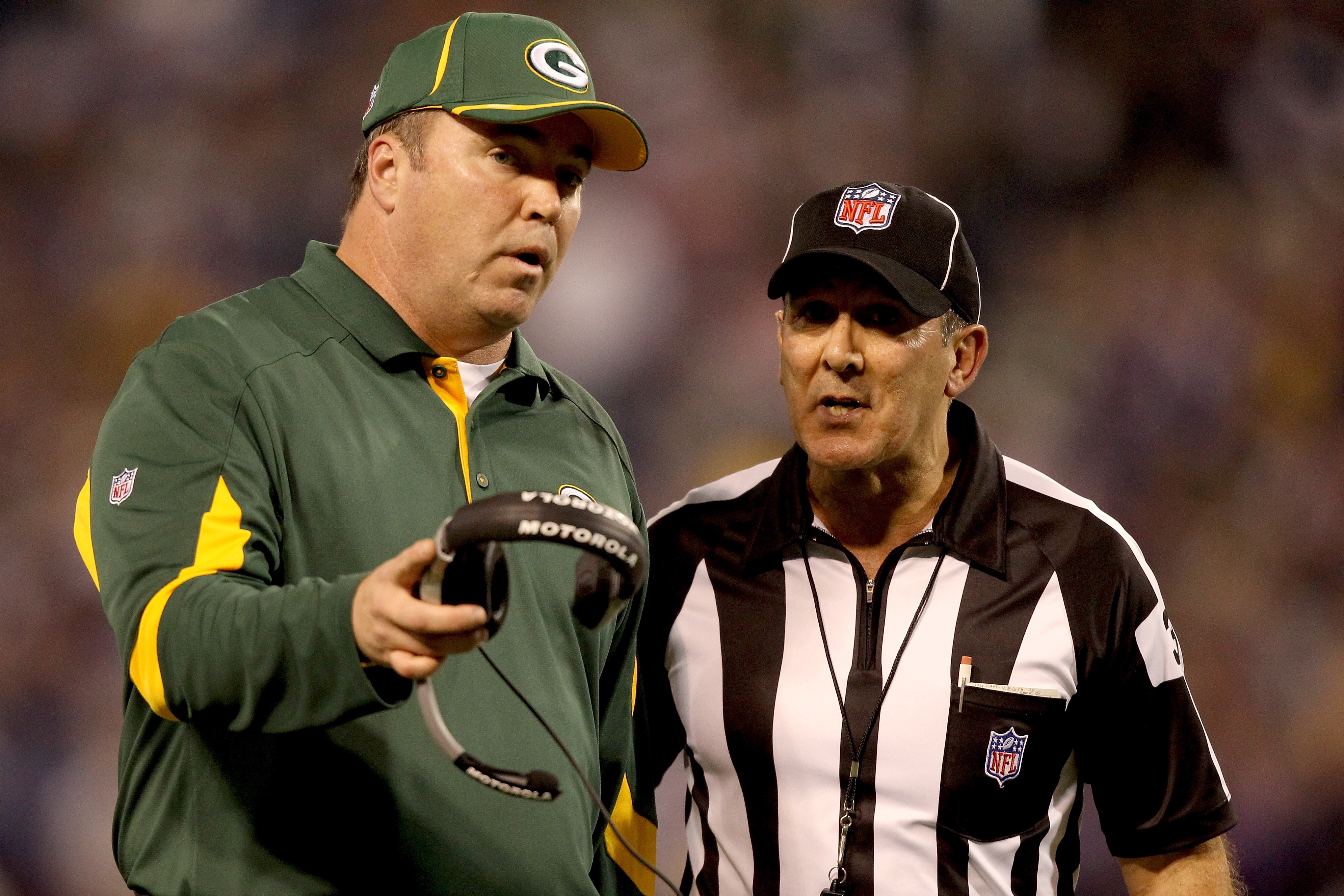 MINNEAPOLIS - NOVEMBER 21:  Head Coach Mike McCarthy of the Green Bay Packers discusses a call with Head Linesman Tony Veteri while playing the Minnesota Vikings at the Hubert H. Humphrey Metrodome on November 21, 2010 in Minneapolis, Minnesota.  (Photo b