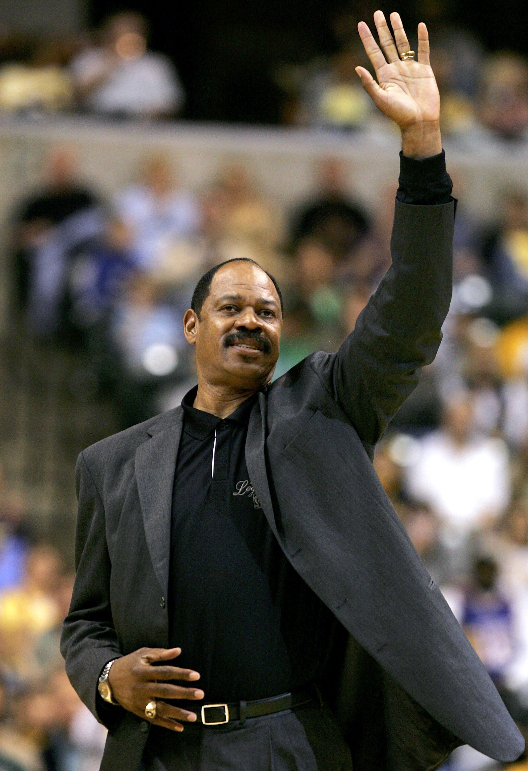 INDIANAPOLIS - APRIL 29:  Former NBA player Artis Gilmore acknowledges the crowd after being introduced during a timeout between the Indiana Pacers and the New Jersey Nets in game four of the Eastern Conference Quarterfinals during the 2006 NBA playoffs o