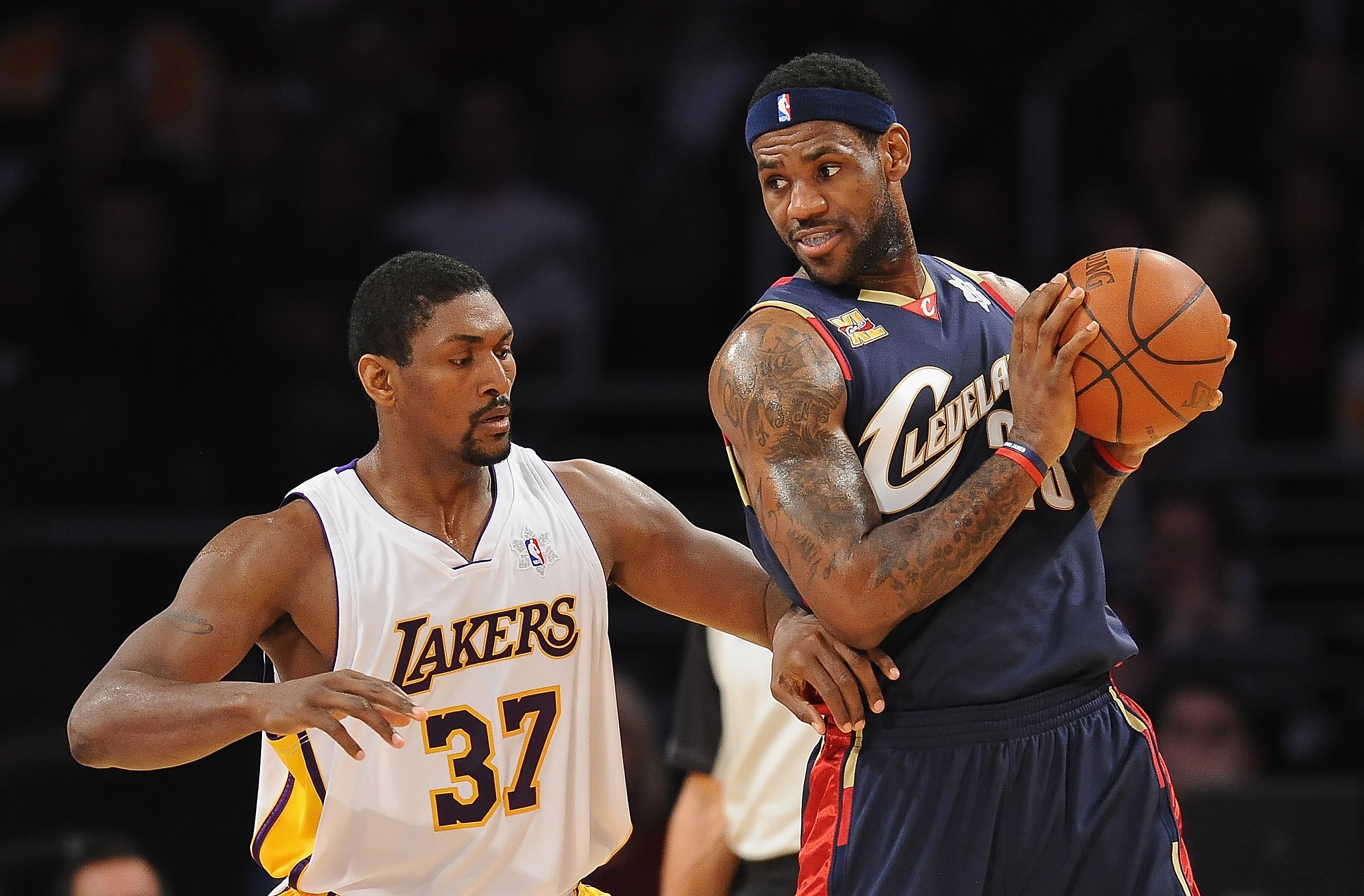 LOS ANGELES, CA - DECEMBER 25:  LeBron James #23 of the Cleveland Cavaliers drives against Ron Artest #37 of the Los Angeles Lakers at Staples Center on December 25, 2009 in Los Angeles, California. NOTE TO USER: User expressly acknowledges and agrees tha