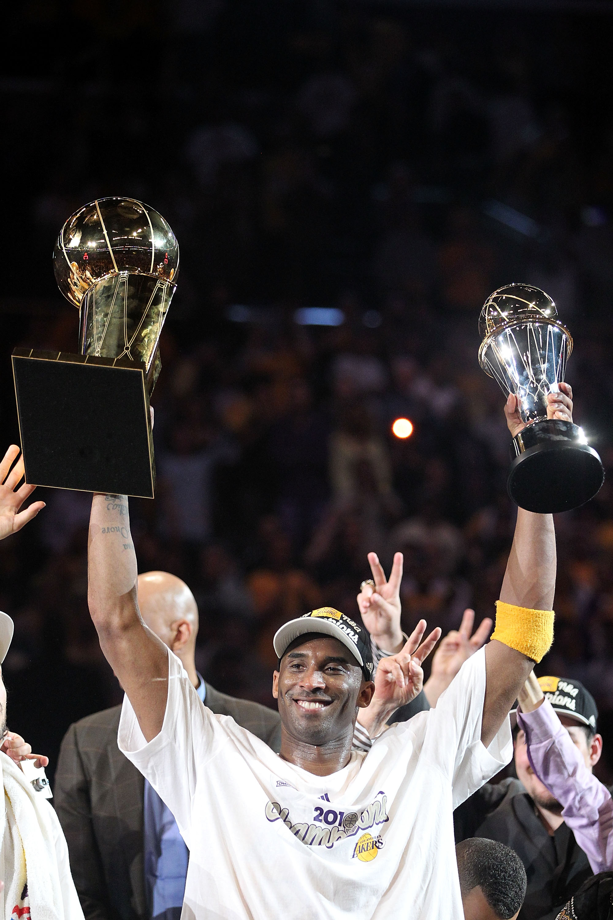 LOS ANGELES, CA - JUNE 17:  Kobe Bryant #24 of the Los Angeles Lakers holds both the Larry O'Brien trophy and the Bill Russell Finals MVP trophy after the Lakers defeated the Boston Celtics 83-79 in Game Seven of the 2010 NBA Finals at Staples Center on J