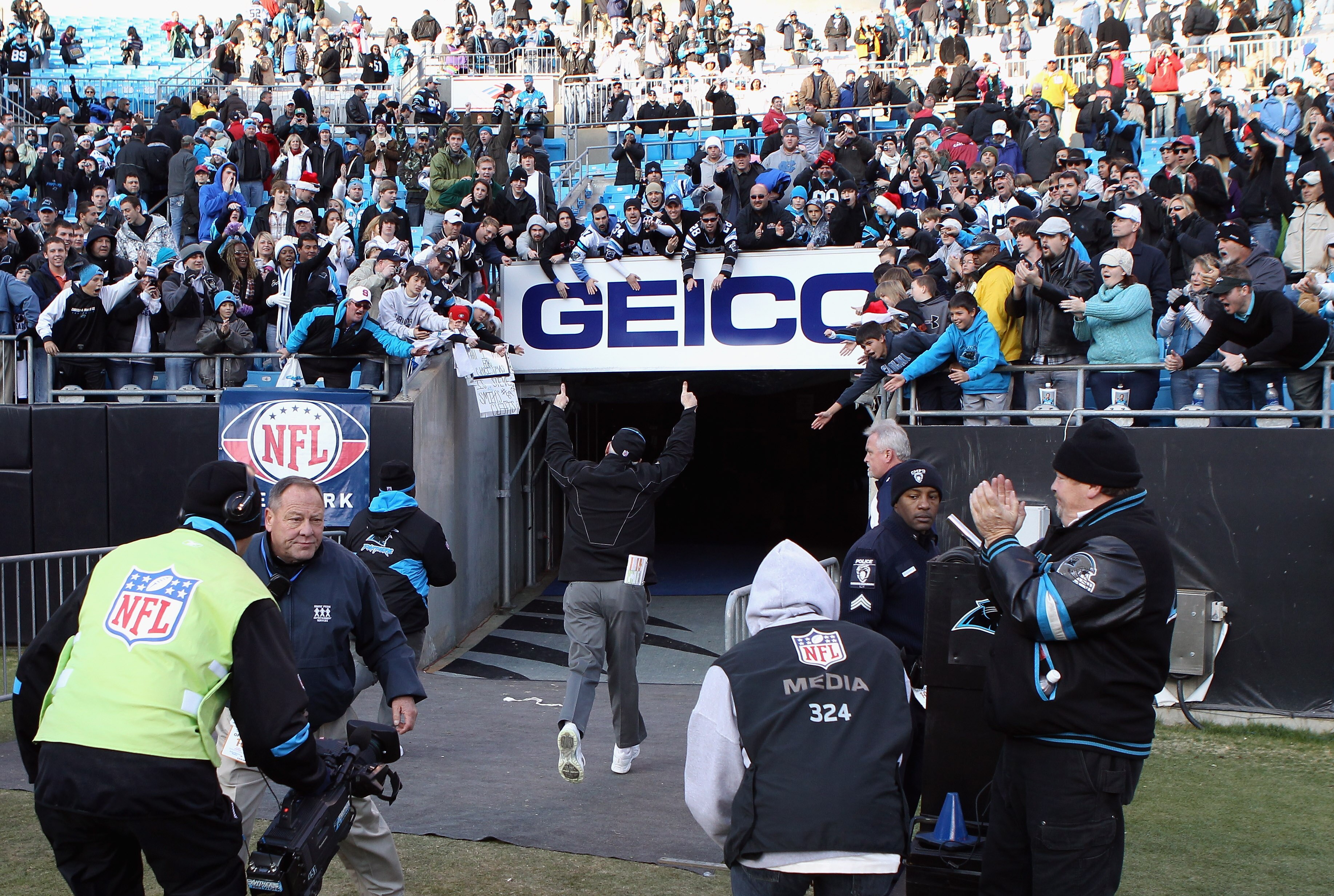 CHARLOTTE, NC - DECEMBER 19:  Head coach John Fox of the Carolina Panthers runs off the field after a 19-12 victory over the Arizona Cardinals during their game at Bank of America Stadium on December 19, 2010 in Charlotte, North Carolina.  (Photo by Stree
