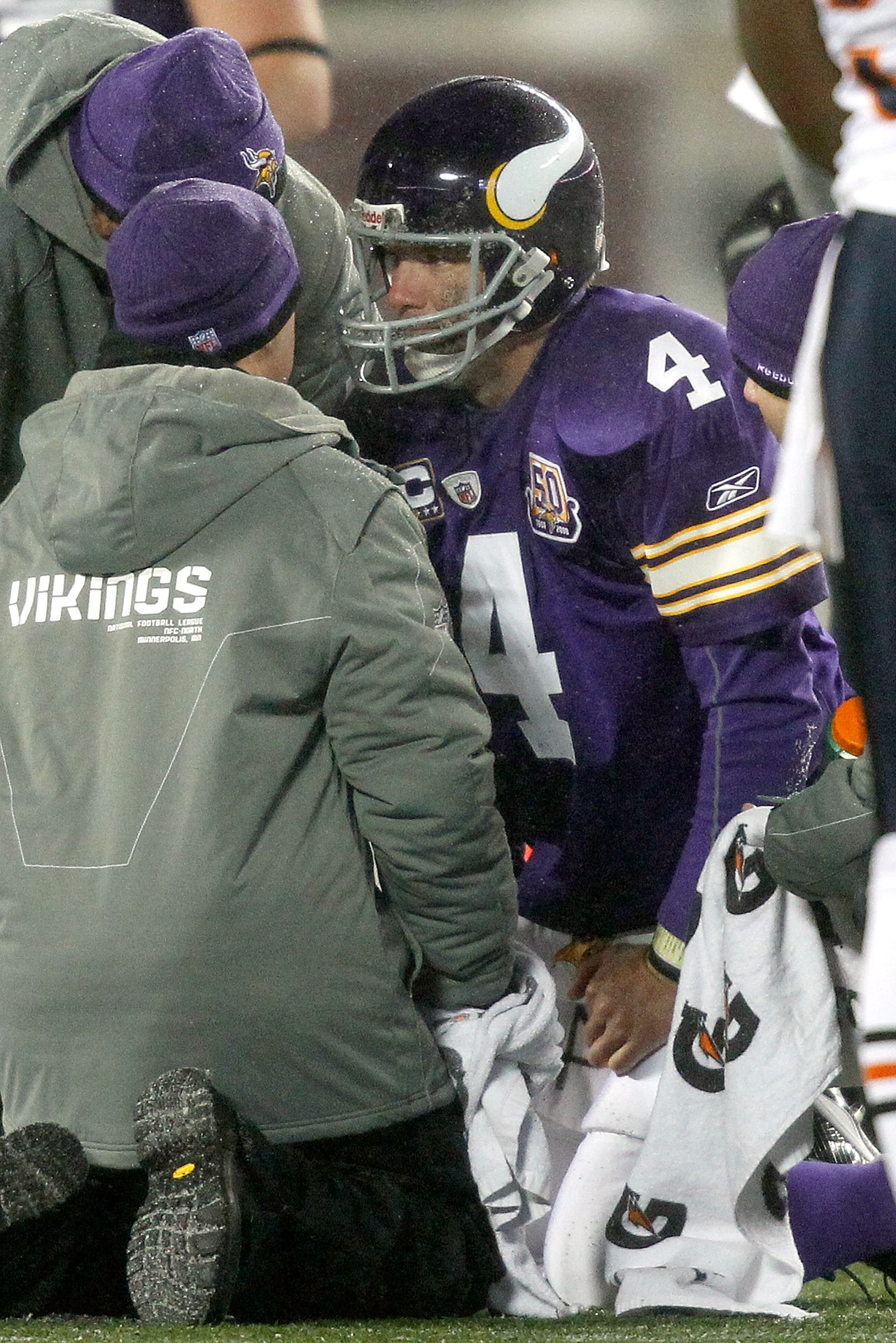 MINNEAPOLIS, MN - DECEMBER 20:  Quarterback Brett Favre #4 of the Minnesota Vikings is attended to after being sacked by the Chicago Bears at TCF Bank Stadium on December 20, 2010 in Minneapolis, Minnesota.  (Photo by Matthew Stockman/Getty Images)