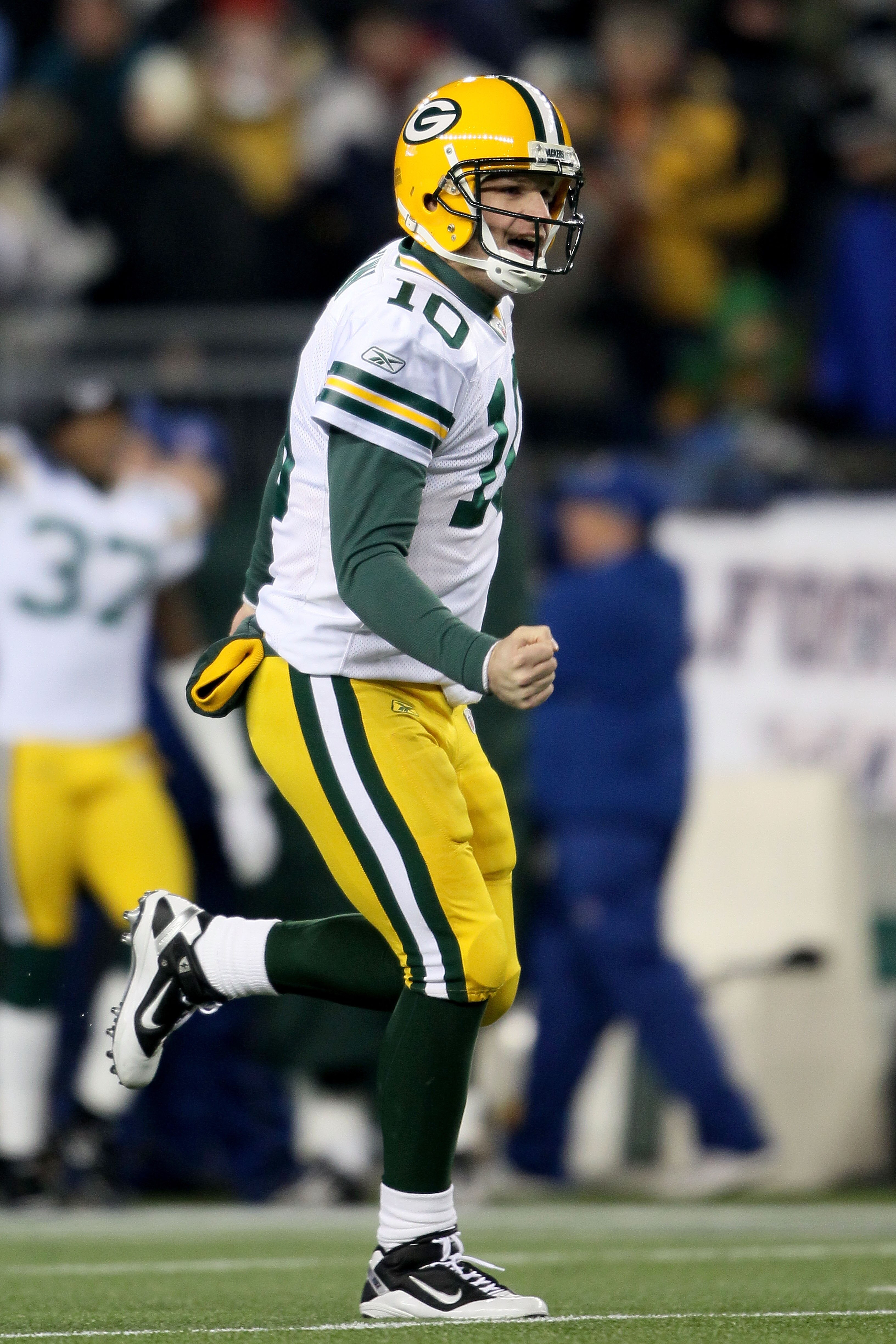 FOXBORO, MA - DECEMBER 19:  Quarterback Matt Flynn #10 of the Green Bay Packers celebrates after passing to wide receiver James Jones #89 (not pictured) who ran 66 yards to score a touchdown in the second quarter against the New England Patriots at Gillet