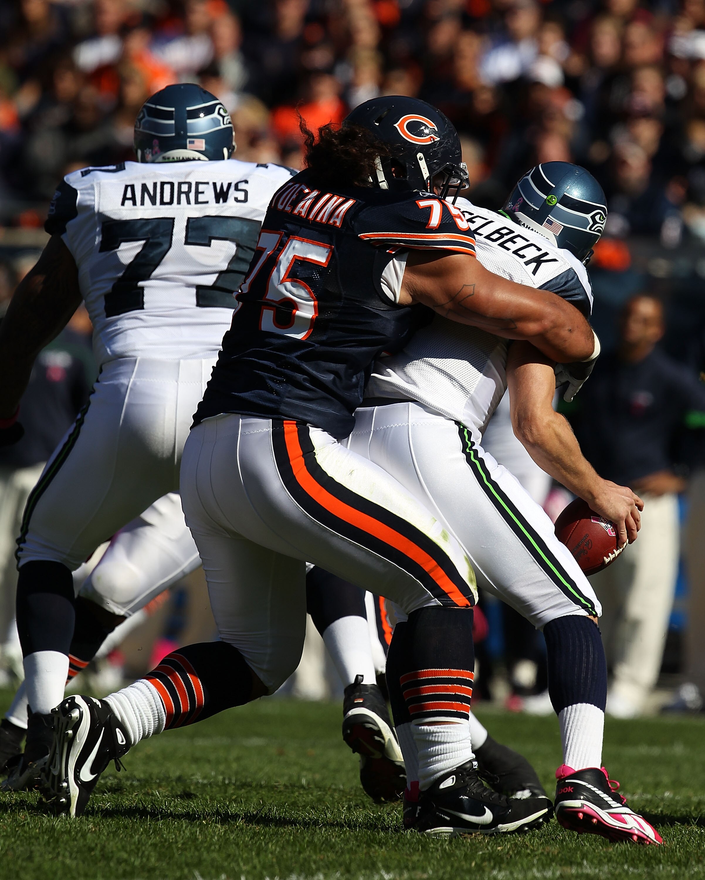 CHICAGO - OCTOBER 17: Matt Toeaina #75 of the Chicago Bears hits Matt Hasselbeck #8 of the Seattle Seahawks at Soldier Field on October 17, 2010 in Chicago, Illinois. The Seahawks defeated the Bears 23-20. (Photo by Jonathan Daniel/Getty Images)