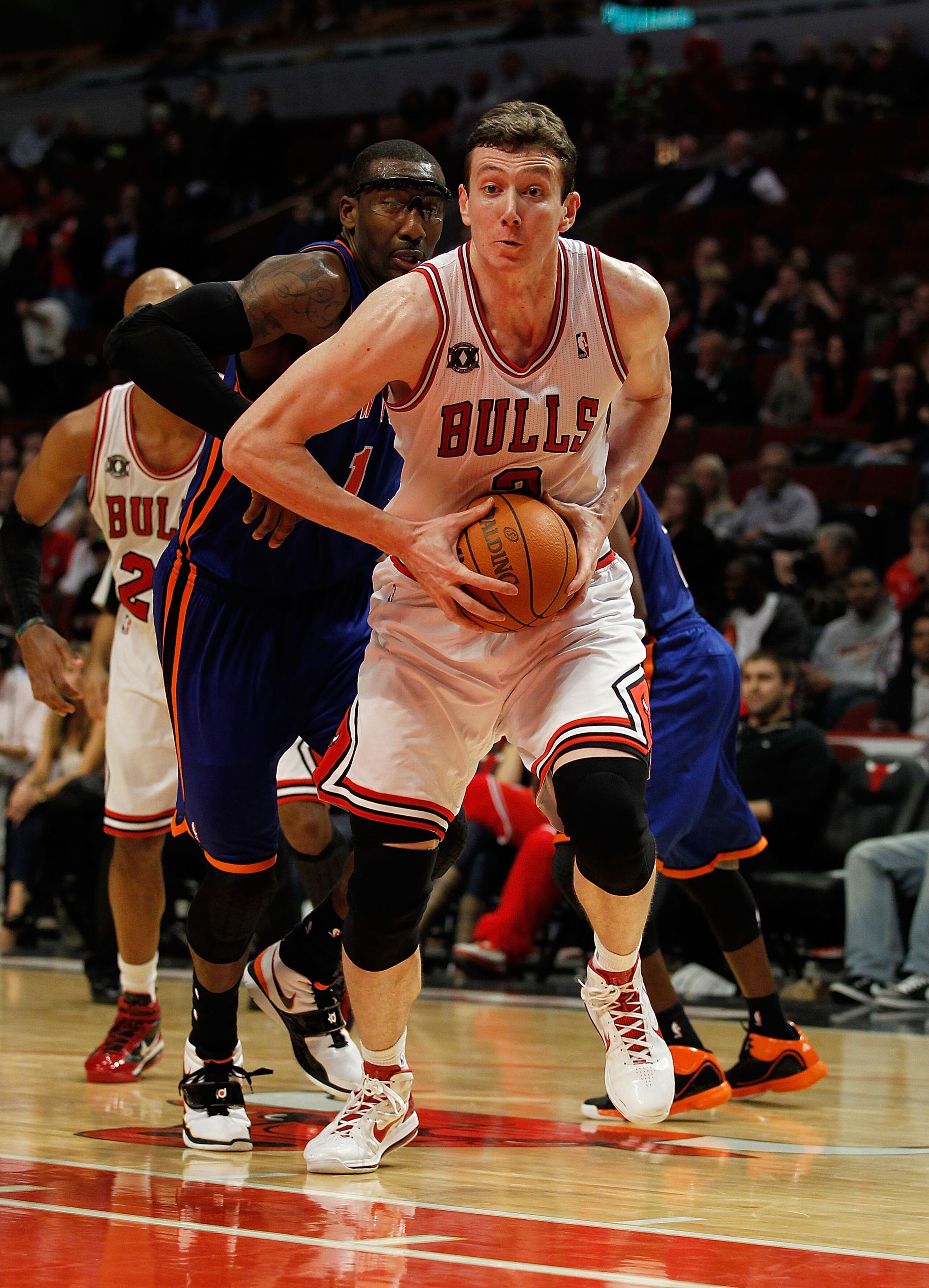 CHICAGO - NOVEMBER 04: Omer Asik #3 of the Chicago Bulls goes up for a dunk past Amar'e Stoudemire #1 of the New York Knicks at the United Center on November 4, 2010 in Chicago, Illinois. The Knicks defeated the Bulls 120-112. NOTE TO USER: User expressly