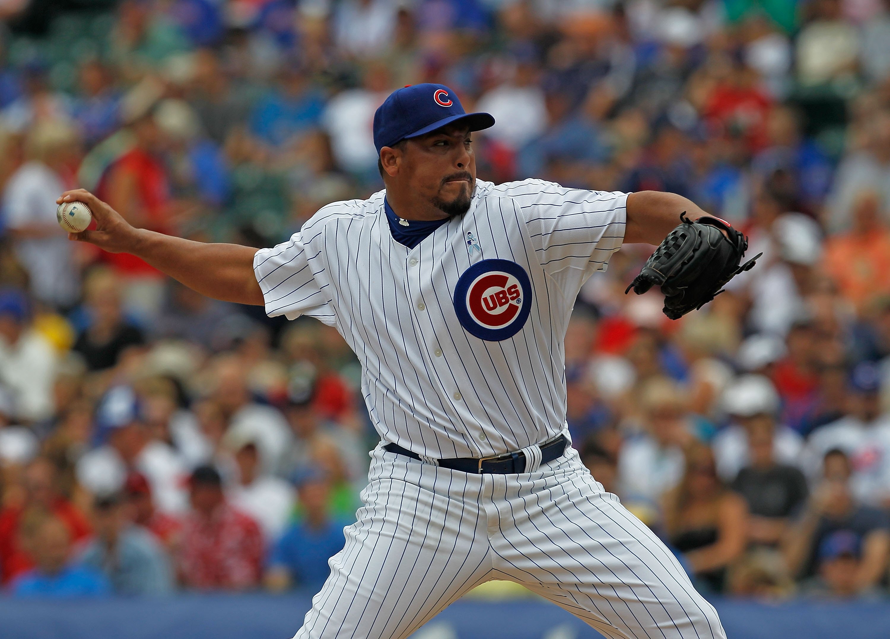 CHICAGO - JUNE 20: Starting pitcher Carlos Zambrano #38 of the Chicago Cubs delivers the ball against the Los Angeles Angels of Anaheim at Wrigley Field on June 20, 2010 in Chicago, Illinois. The Cubs defeated the Angels 12-1. (Photo by Jonathan Daniel/Ge