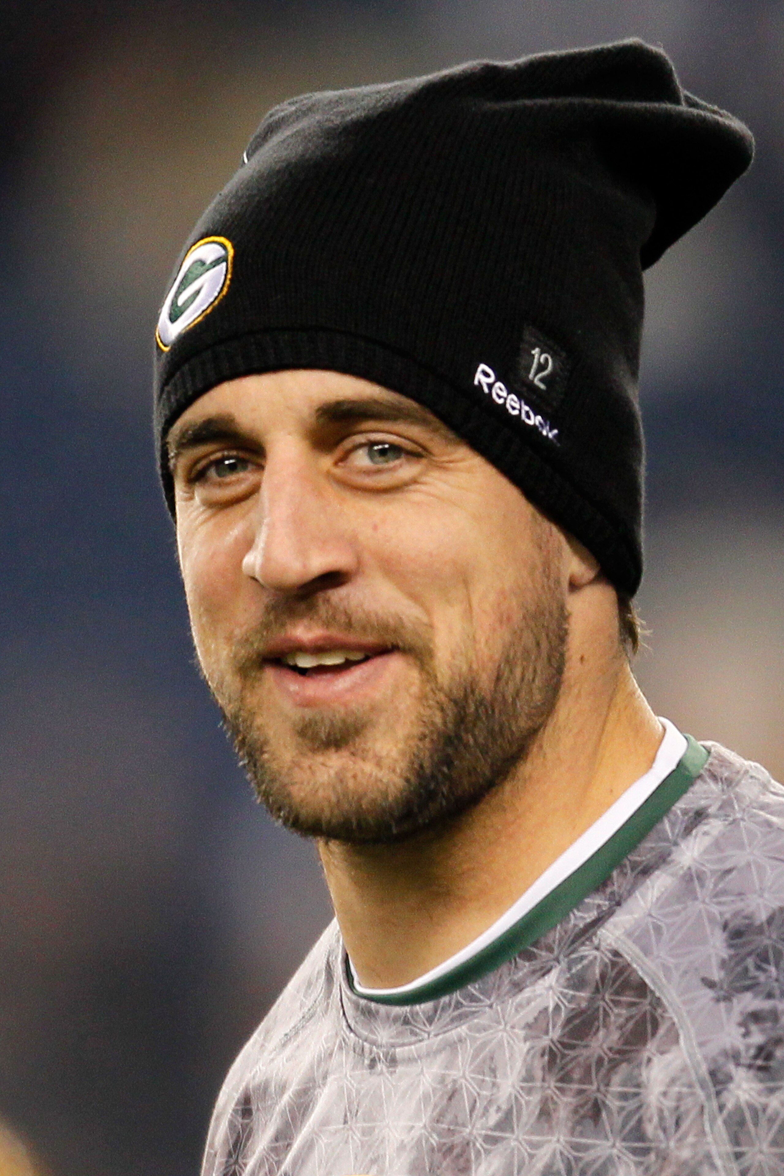 FOXBORO, MA - DECEMBER 19: Quarterback Aaron Rodgers #12 of the Green Bay Packers, inactive due to an injury, looks on during warm-ups before the game against the New England Patriots at Gillette Stadium on December 19, 2010 in Foxboro, Massachusetts. ( FOXBORO, MA - DECEMBER 19: Quarterback Aaron Rodgers #12 of the Green Bay Packers, inactive due to an injury, looks on during warm-ups before the game against the New England Patriots at Gillette Stadium on December 19, 2010 in Foxboro, Massachusetts. (