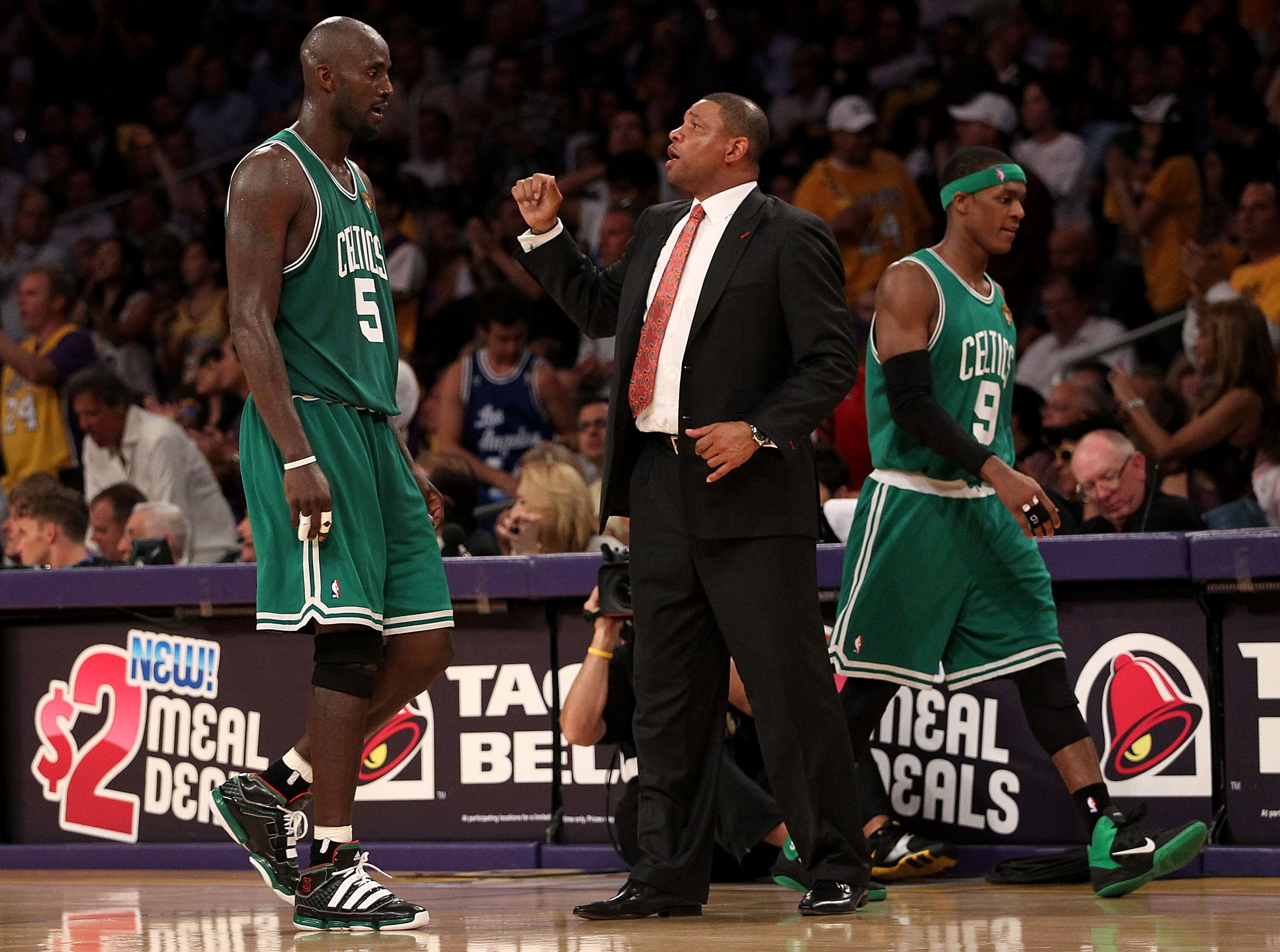 LOS ANGELES, CA - JUNE 15:  Kevin Garnett #5 and Rajon Rondo #9 of the Boston Celtics walk to the bench past head coach Doc Rivers of the Celtics in the second half against the Los Angeles Lakers in Game Six of the 2010 NBA Finals at Staples Center on Jun