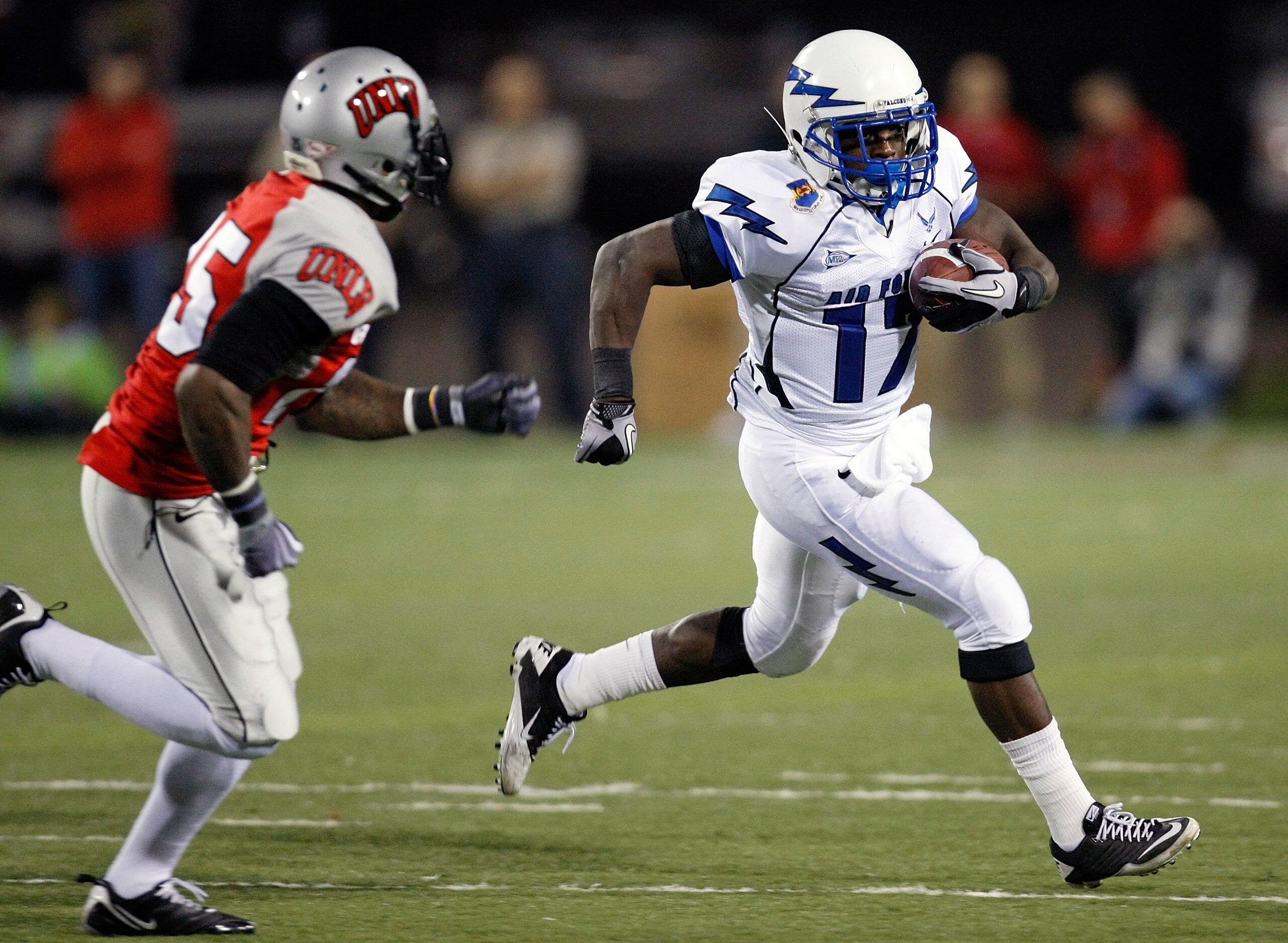 LAS VEGAS - NOVEMBER 18: Asher Clark #17 of the Air Force Falcons runs for yardage against Mike Grant #17 of the UNLV Rebels during their game at Sam Boyd Stadium November 18, 2010 in Las Vegas, Nevada. Air Force won 35-20. (Photo by Ethan Miller/Getty LAS VEGAS - NOVEMBER 18: Asher Clark #17 of the Air Force Falcons runs for yardage against Mike Grant #17 of the UNLV Rebels during their game at Sam Boyd Stadium November 18, 2010 in Las Vegas, Nevada. Air Force won 35-20. (Photo by Ethan Miller/Getty