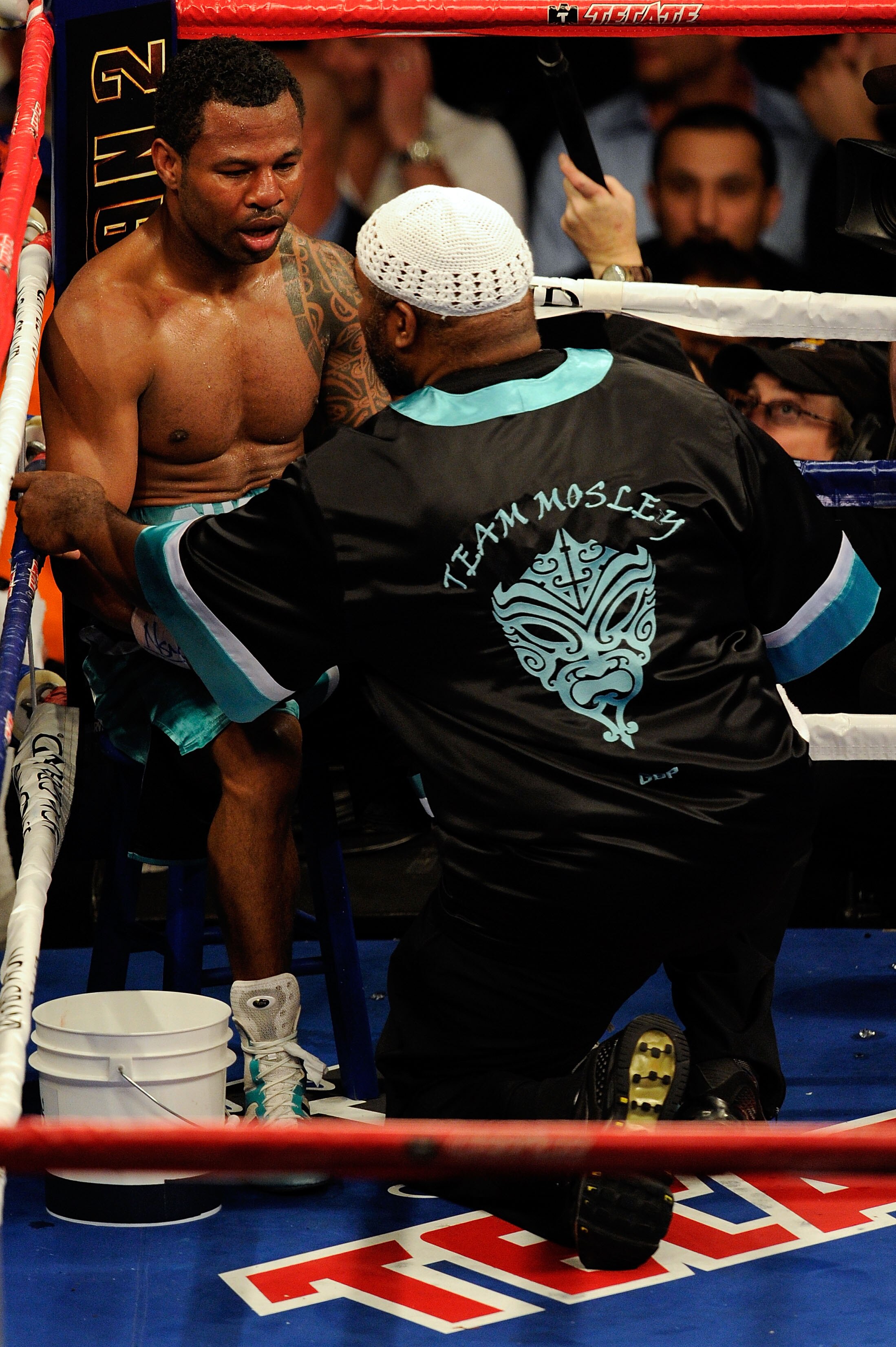 LAS VEGAS - MAY 01:  Shane Mosley talks with trainer Naazim Richardson in his corner during a round break against Floyd Mayweather Jr. during the welterweight fight at the MGM Grand Garden Arena on May 1, 2010 in Las Vegas, Nevada.  (Photo by Ethan Miller