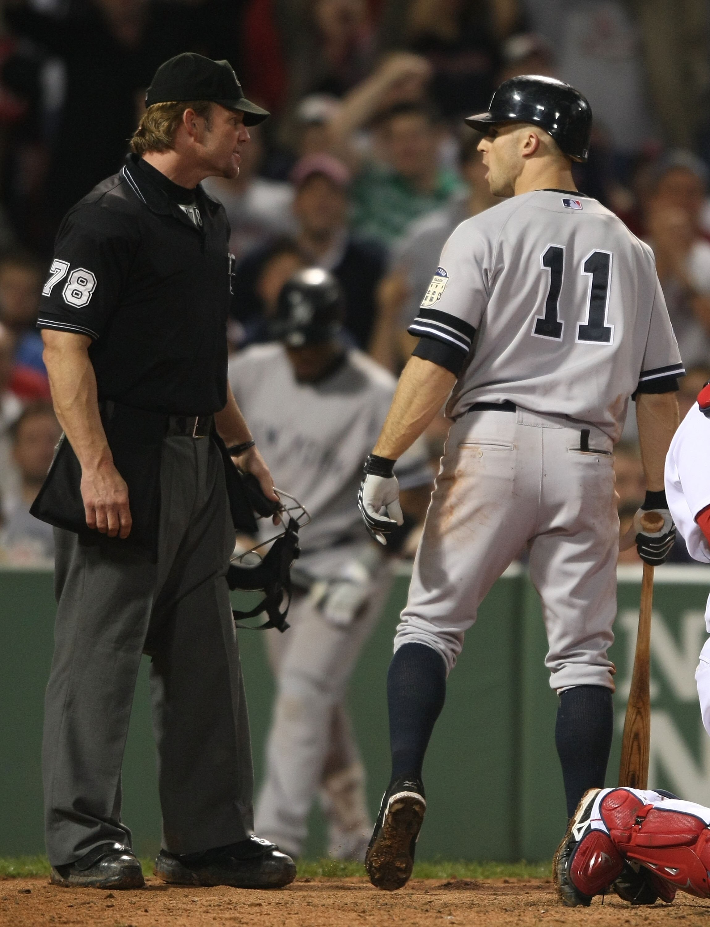 BOSTON - SEPTEMBER 28:  Brett Gardner #11 of the New York Yankees argues his strikeout with home plate umpire Jim Wolf #78 in the game against the Boston Red Sox on September 28, 2008 during game two of the double header at Fenway Park in Boston, Massachu