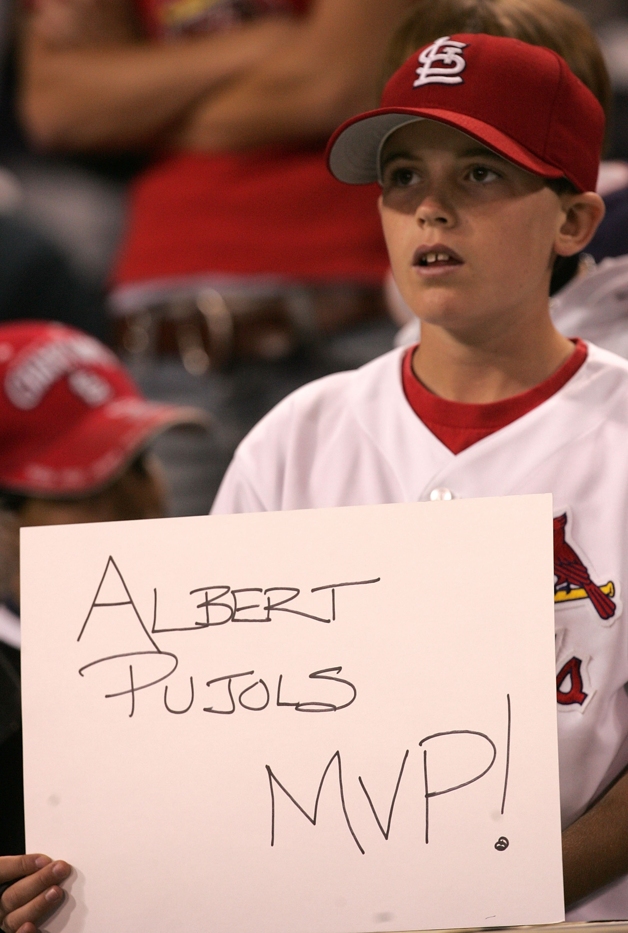SAN DIEGO - OCTOBER 08: A young St. Louis Cardinals fan holds up a sign that reads 'Albert Pujols MVP!' during Game Three of the 2005 National League Division Series against the San Diego Padres on October 8, 2005 at Petco Park in San Diego, California SAN DIEGO - OCTOBER 08: A young St. Louis Cardinals fan holds up a sign that reads 'Albert Pujols MVP!' during Game Three of the 2005 National League Division Series against the San Diego Padres on October 8, 2005 at Petco Park in San Diego, California