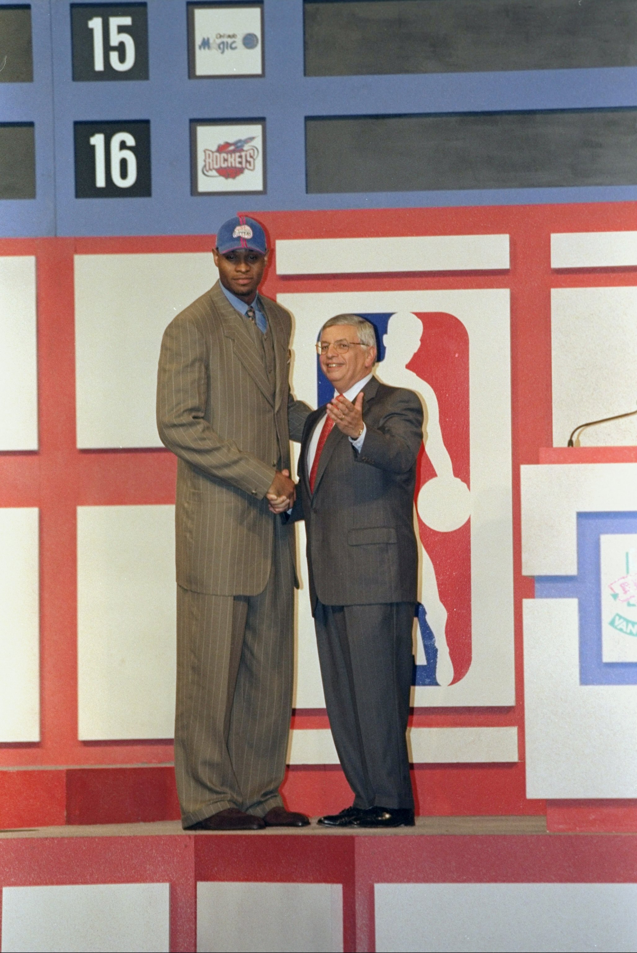 24 Jun 1998: A picture of the 1st Pick Michael Olowokandi by the Los Angeles Clippers shaking hands with David Stern the NBA Commissioner during the NBA Draft at the General Motors Palace in Vancouver, Canada. FOR EDITORIAL USE ONLY