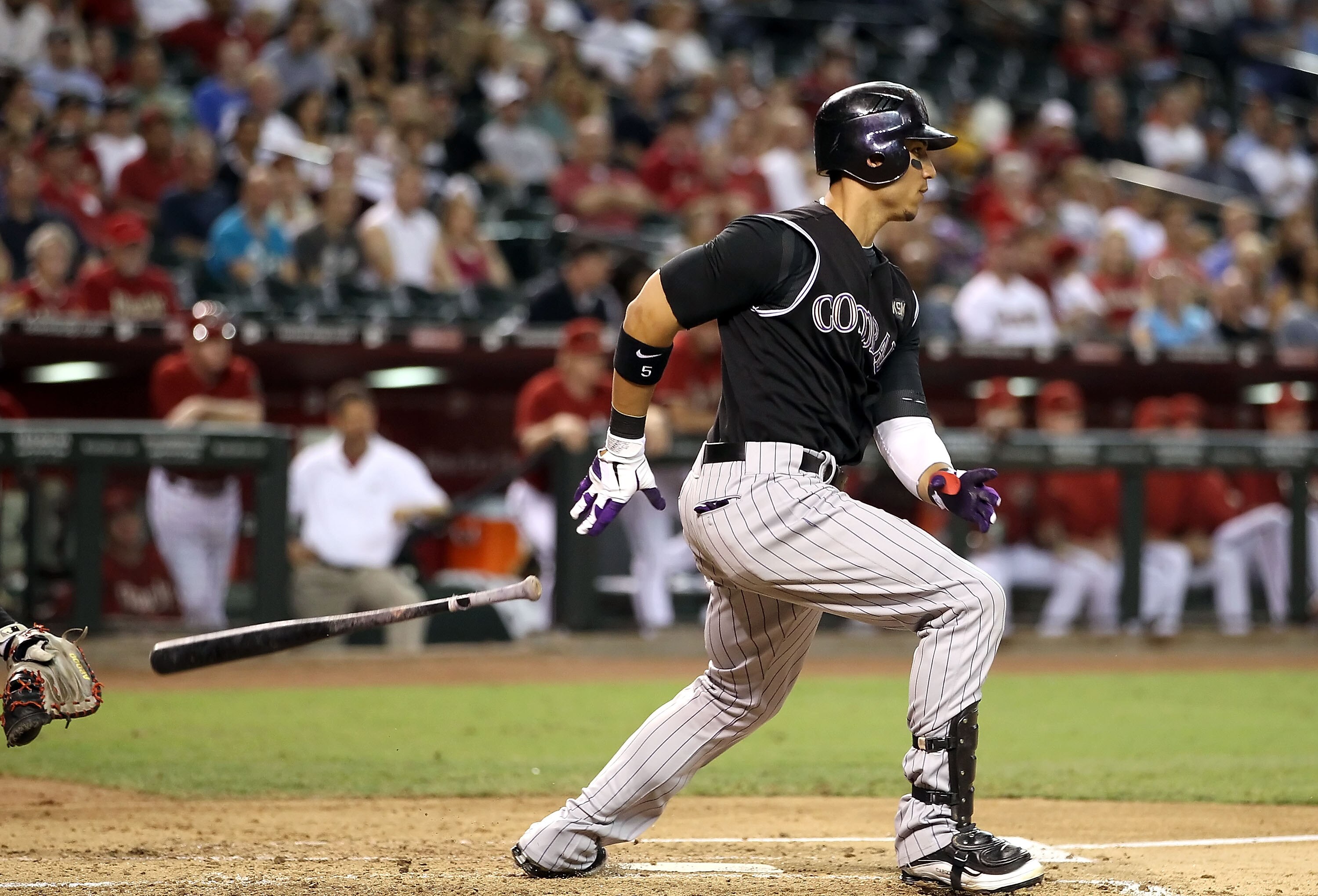 PHOENIX - SEPTEMBER 22:  Carlos Gonzalez #5 of the Colorado Rockies bats against the Arizona Diamondbacks during the Major League Baseball game at Chase Field on September 22, 2010 in Phoenix, Arizona.  (Photo by Christian Petersen/Getty Images)