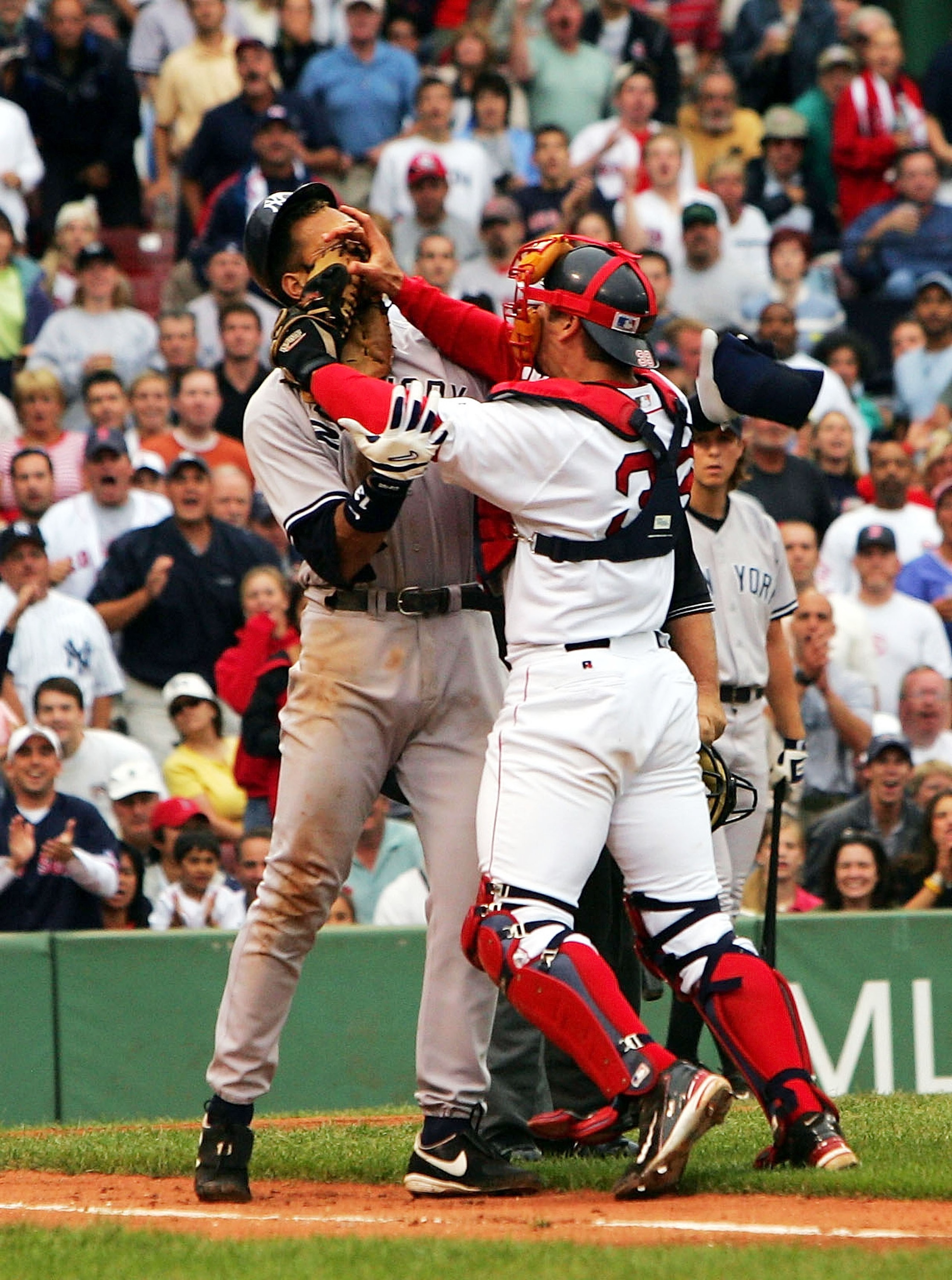 BOSTON - JULY 24: Alex Rodriguez #13 of the New York Yankees gets into a fight with catcher Jason Varitek #33 of the Boston Red Sox after Rodriguez was hit by a pitch in the third inning on July 24, 2004 at Fenway Park in Boston, Massachusetts. (Photo b BOSTON - JULY 24: Alex Rodriguez #13 of the New York Yankees gets into a fight with catcher Jason Varitek #33 of the Boston Red Sox after Rodriguez was hit by a pitch in the third inning on July 24, 2004 at Fenway Park in Boston, Massachusetts. (Photo b