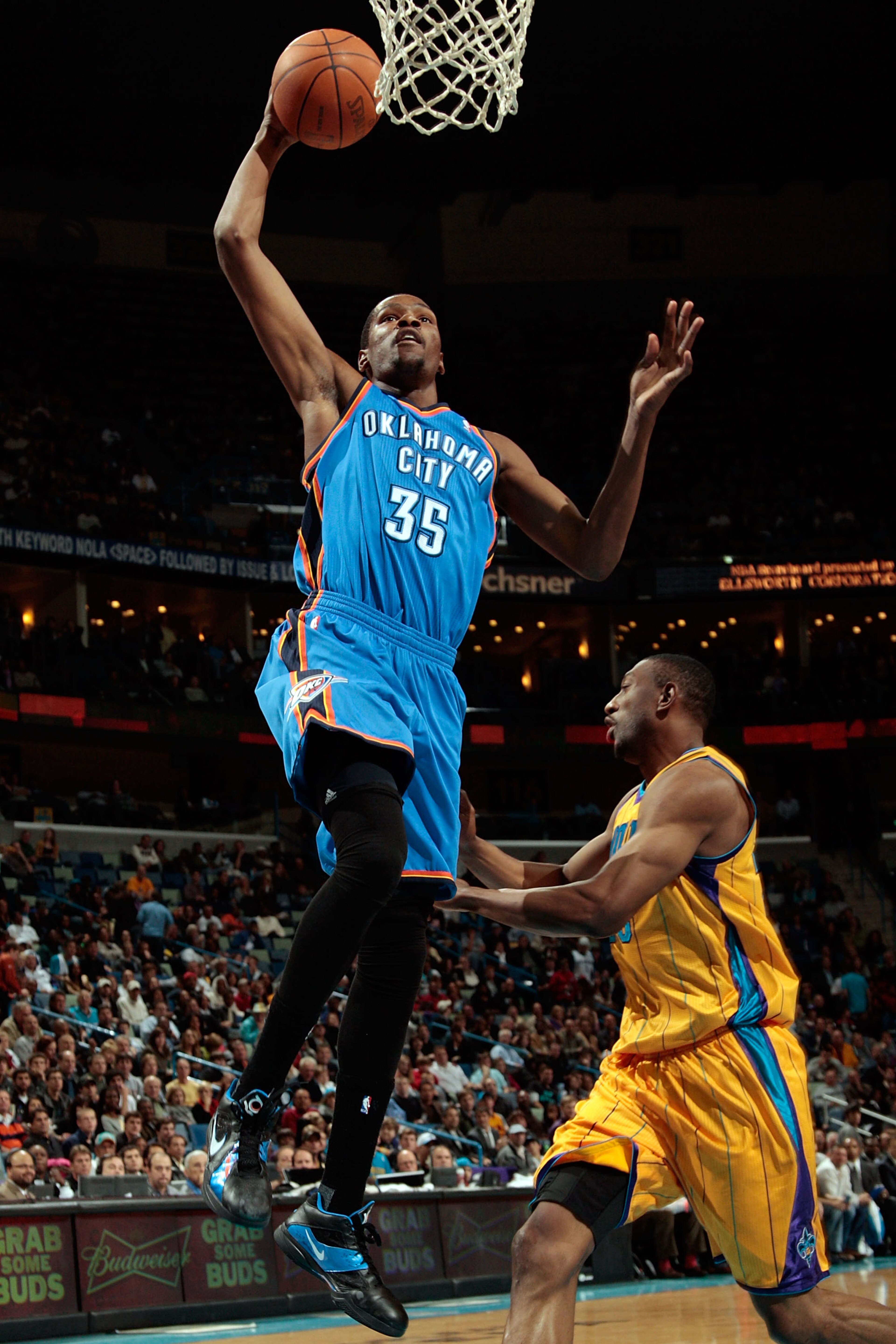 NEW ORLEANS, LA - DECEMBER 10: Kevin Durant #35 of the Oklahoma City Thunder dunks the ball over D.J. Mbenga #28 of the New Orleans Hornets at New Orleans Arena on December 10, 2010 in New Orleans, Louisiana. The Thunder defeated the Hornets 97-92. NEW ORLEANS, LA - DECEMBER 10: Kevin Durant #35 of the Oklahoma City Thunder dunks the ball over D.J. Mbenga #28 of the New Orleans Hornets at New Orleans Arena on December 10, 2010 in New Orleans, Louisiana. The Thunder defeated the Hornets 97-92.