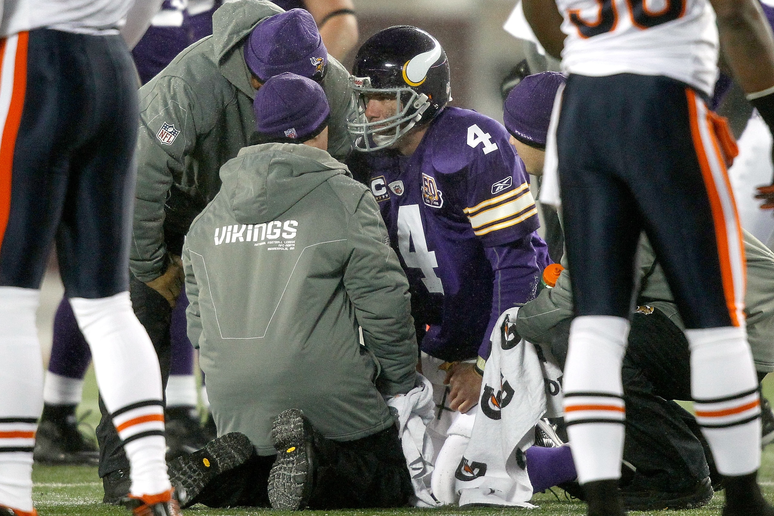 MINNEAPOLIS, MN - DECEMBER 20:  Quarterback Brett Favre #4 of the Minnesota Vikings is attended to after being sacked by the Chicago Bears at TCF Bank Stadium on December 20, 2010 in Minneapolis, Minnesota.  (Photo by Matthew Stockman/Getty Images)