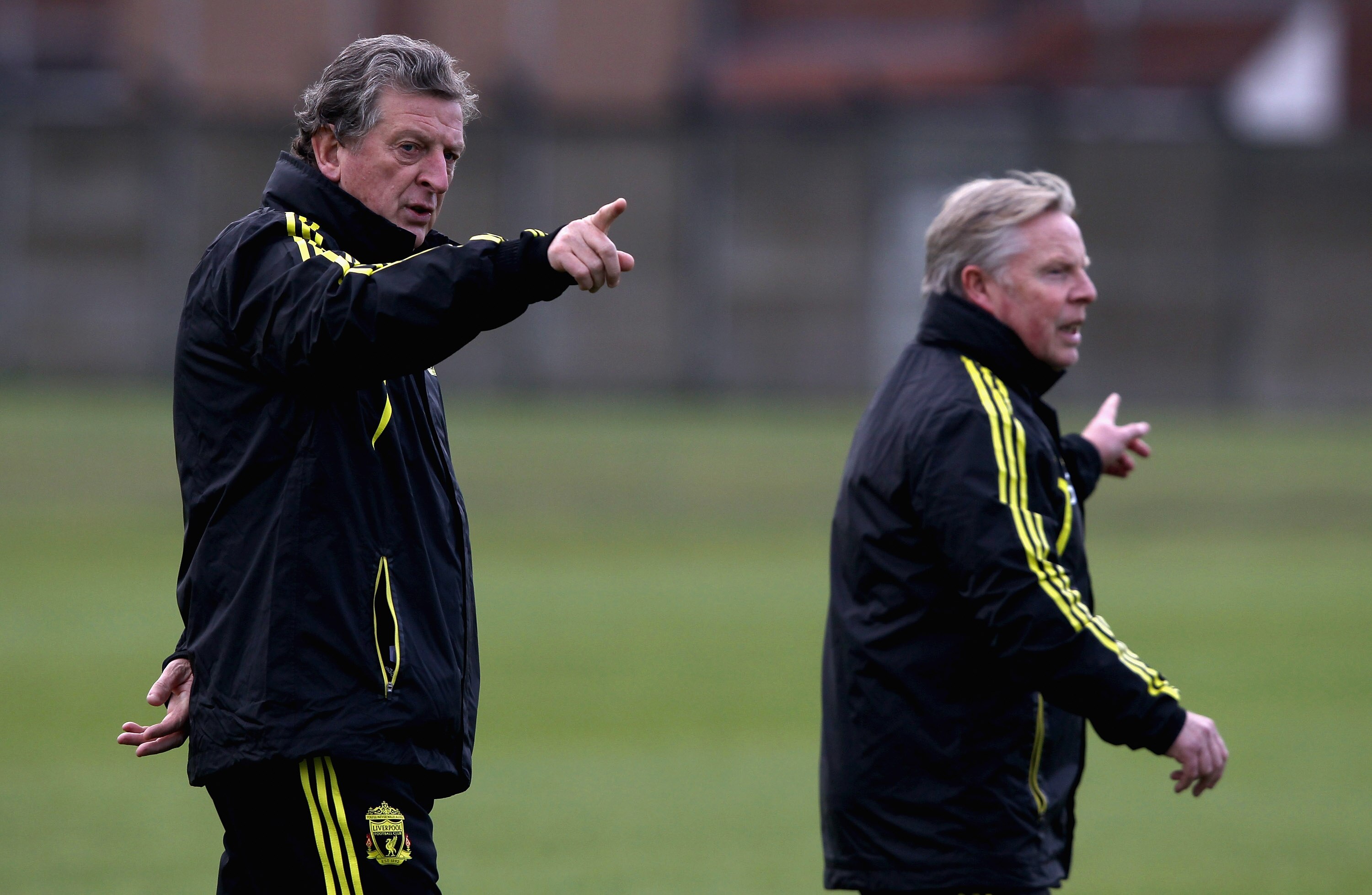 LIVERPOOL, ENGLAND - DECEMBER 14:  Liverpool manager Roy Hodgson gives instructions to his team along side assistant manager Sammy Lee during a training session ahead of their UEFA Europa League Group K match against Utrecht at Melwood Training Ground on