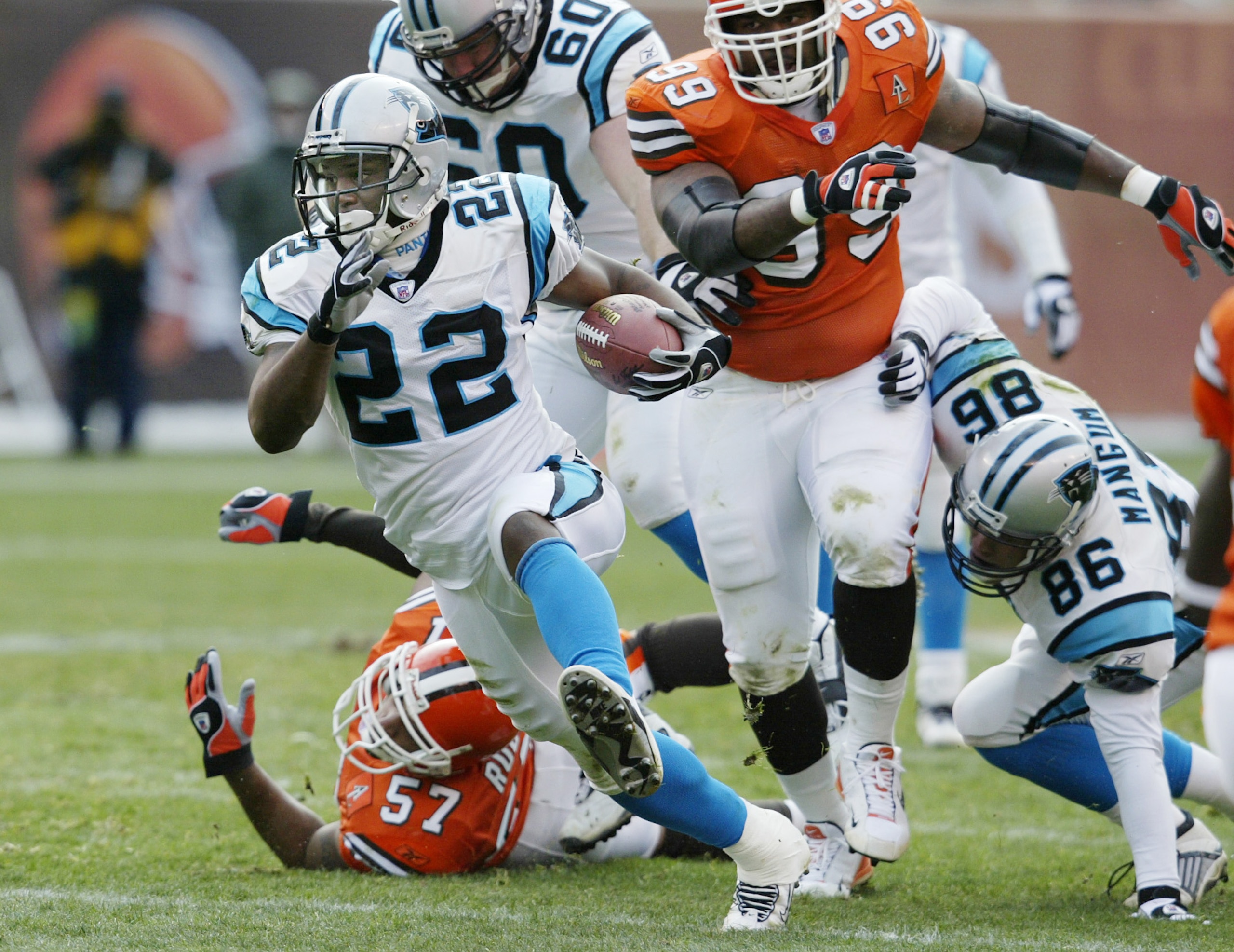 CLEVELAND - DECEMBER 1: Dee Brown #22 of the Carolina Panthers rushes for a first down against the Cleveland Browns on December 1, 2002 at Browns Stadium in Cleveland, Ohio.  Carolina won the game 13-6. (Photo by Tom Pidgeon/Getty Images)
