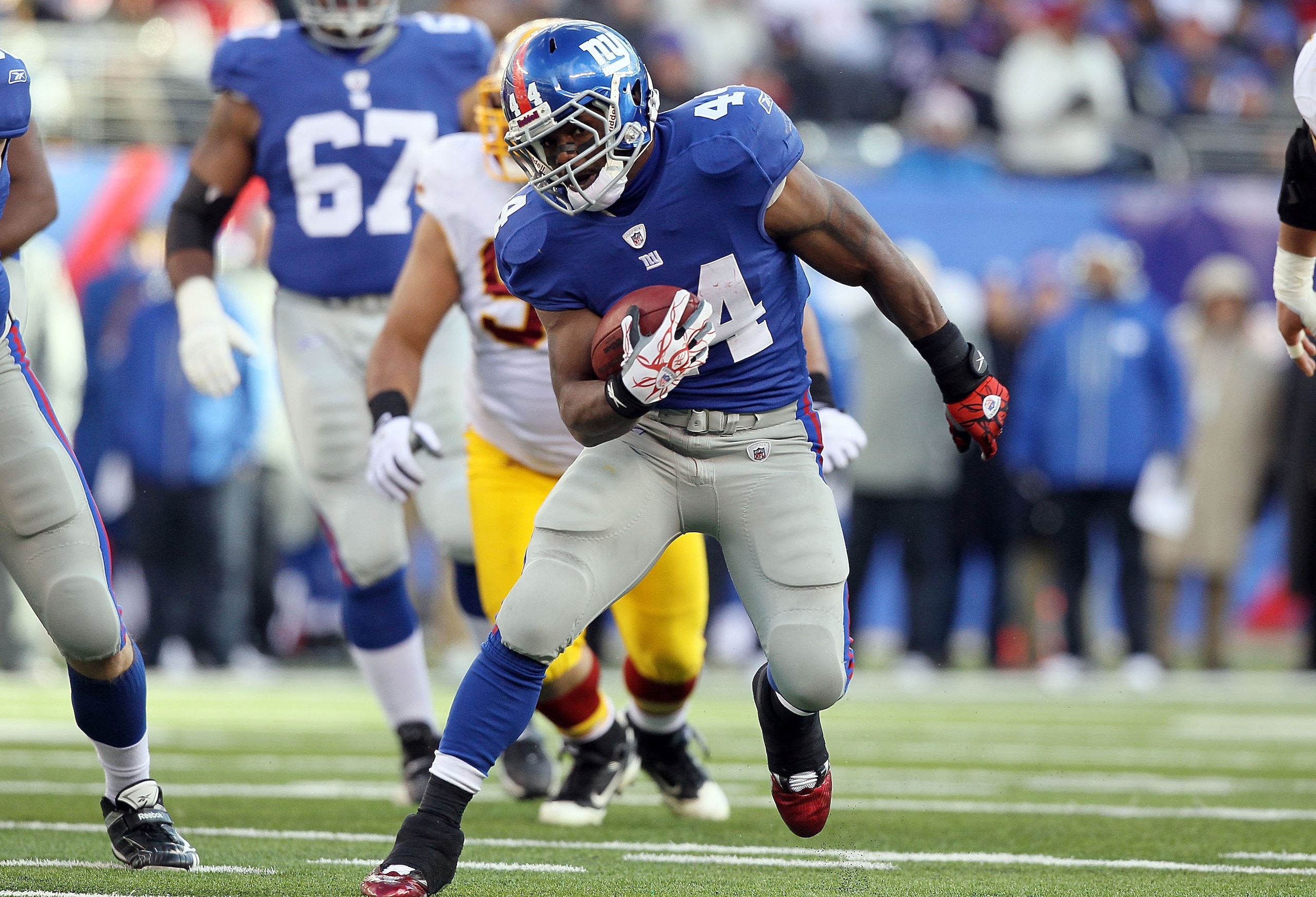 EAST RUTHERFORD, NJ - DECEMBER 05:  Ahmad Bradshaw #44 of the New York Giants runs the ball against the Washington Redskins on December 5, 2010 at the New Meadowlands Stadium in East Rutherford, New Jersey. The Giants defeated the Redskins 31-7.  (Photo b