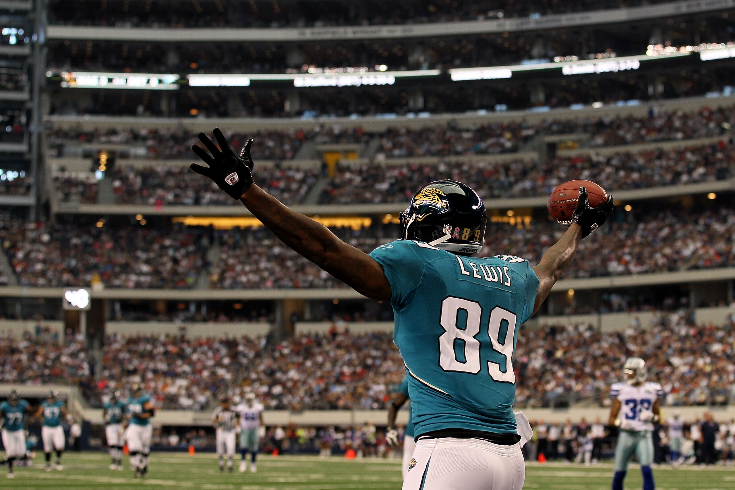 ARLINGTON, TX - OCTOBER 31:  Marcedes Lewis #89 of the Jacksonville Jaguars celebrates after he scored a touchdown against the Dallas Cowboys at Cowboys Stadium on October 31, 2010 in Arlington, Texas.  (Photo by Stephen Dunn/Getty Images)