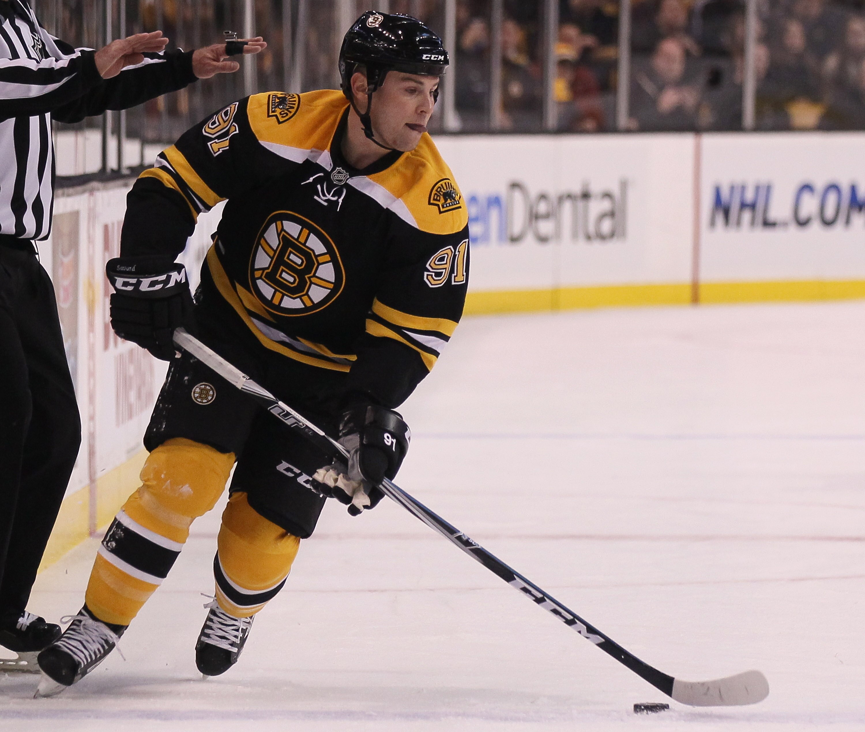 BOSTON, MA - DECEMBER 02:  Marc Savard #91 of the Boston Bruins takes the puck in the first period against the Tampa Bay Lightning on December 2, 2010 at the TD Garden in Boston, Massachusetts.  (Photo by Elsa/Getty Images)