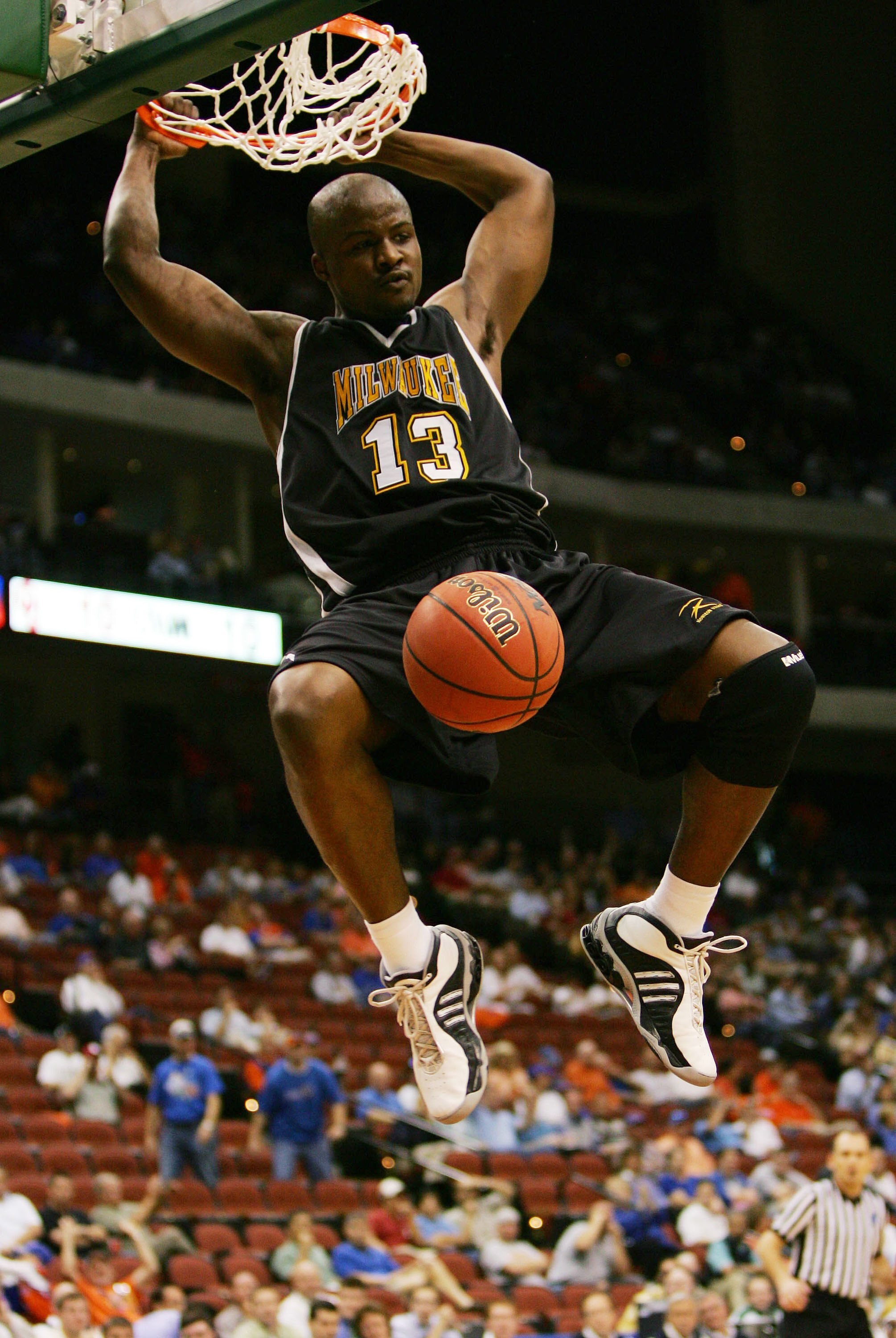 JACKSONVILLE, FL - MARCH 16:  Joah Tucker #13 of the University of Wisconsin-Milwaukee Panthers dunks against the Oklahoma University Sooners during round one of the NCAA National Championship on March 16, 2006 at the Veterans Memorial Arena in Jacksonvil