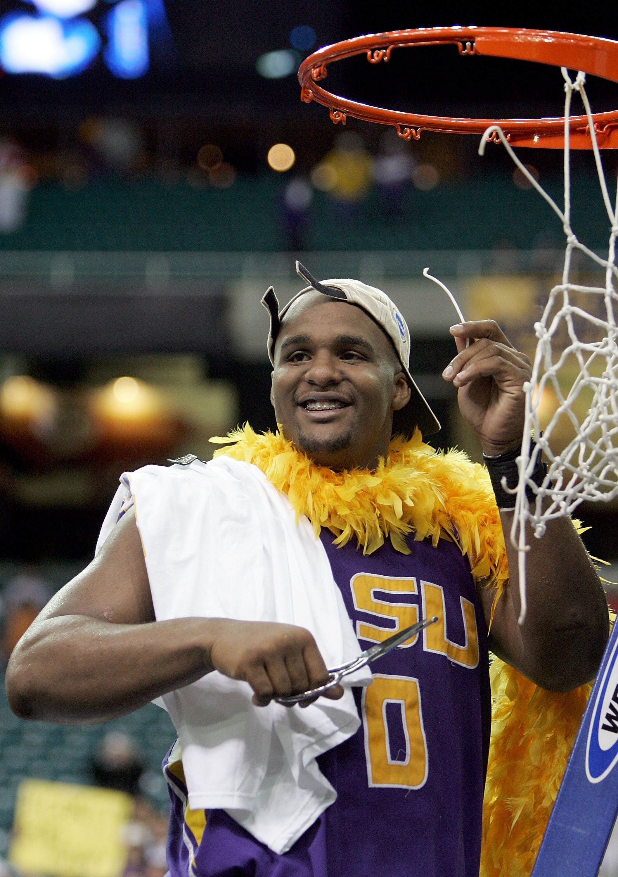 ATLANTA - MARCH 25:  Glen Davis #0 of the LSU Tigers cuts the net after the 70-60 overtime win over the Texas Longhorns during the fourth round game of the 2006 NCAA Division I Men's Basketball Tournament Regional at the Georgia Dome on March 25, 2006 in