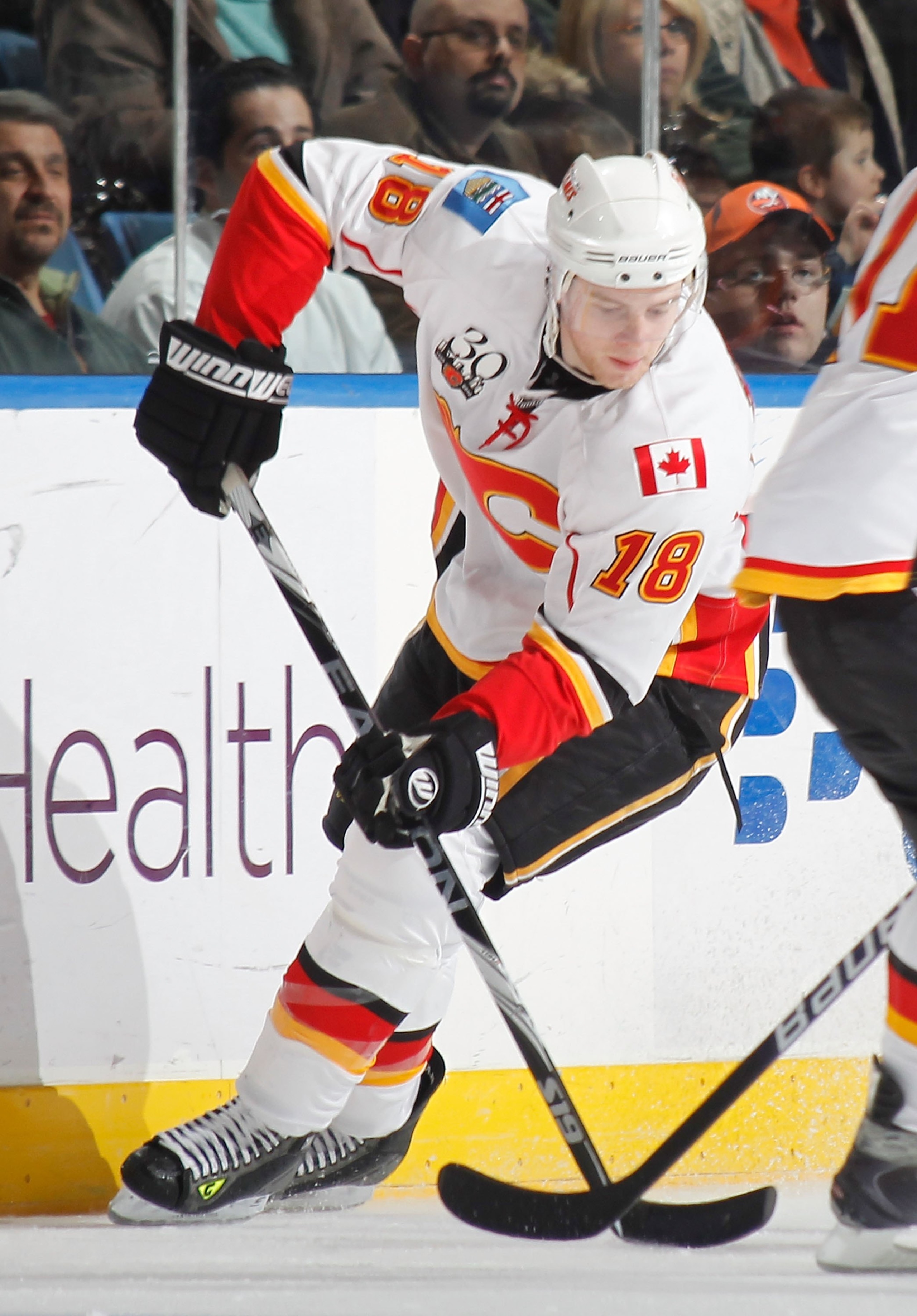 UNIONDALE, NY - MARCH 25: Matt Stajan #18 of the Calgary Flames skates with the puck against the New York Islanders during an NHL game at the Nassau Coliseum on March 25, 2010 in Uniondale, New York. (Photo by Paul Bereswill/Getty Images) UNIONDALE, NY - MARCH 25: Matt Stajan #18 of the Calgary Flames skates with the puck against the New York Islanders during an NHL game at the Nassau Coliseum on March 25, 2010 in Uniondale, New York. (Photo by Paul Bereswill/Getty Images)