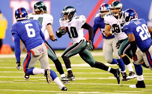 Desean Jackson runs by Matt Dodge after Dodge mistakenly kicked to Jackson, arguably the most dangerous returner in the league.