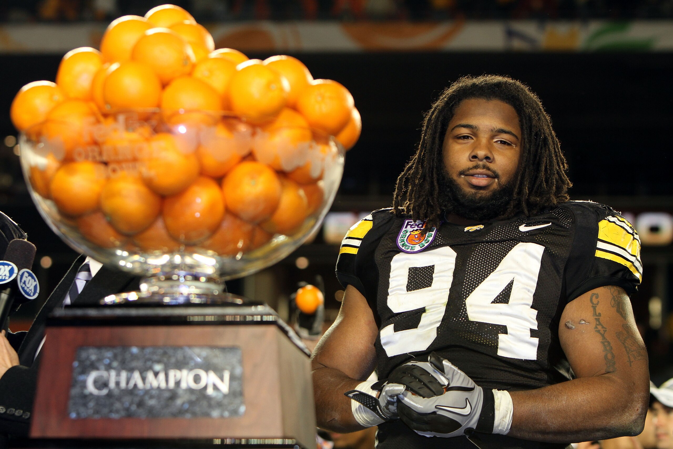 MIAMI GARDENS, FL - JANUARY 05:  Adrian Clayborn #94 of the Iowa Hawkeyes looks on as the Hawkeyes celebrate their 24-14 win against the Georgia Tech Yellow Jackets during the FedEx Orange Bowl at Land Shark Stadium on January 5, 2010 in Miami Gardens, Fl