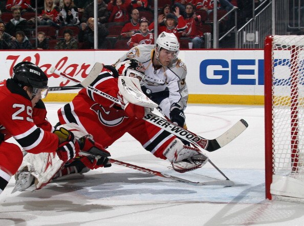 NEWARK, NJ - DECEMBER 17: Colin Wilson #33 of the Nashville Predators watches a shot by Shea Weber #6 elude Martin Brodeur #30 of the New Jersey Devils at 19:33 of the first period at the Prudential Center on December 17, 2010 in Newark, New Jersey.  (Pho