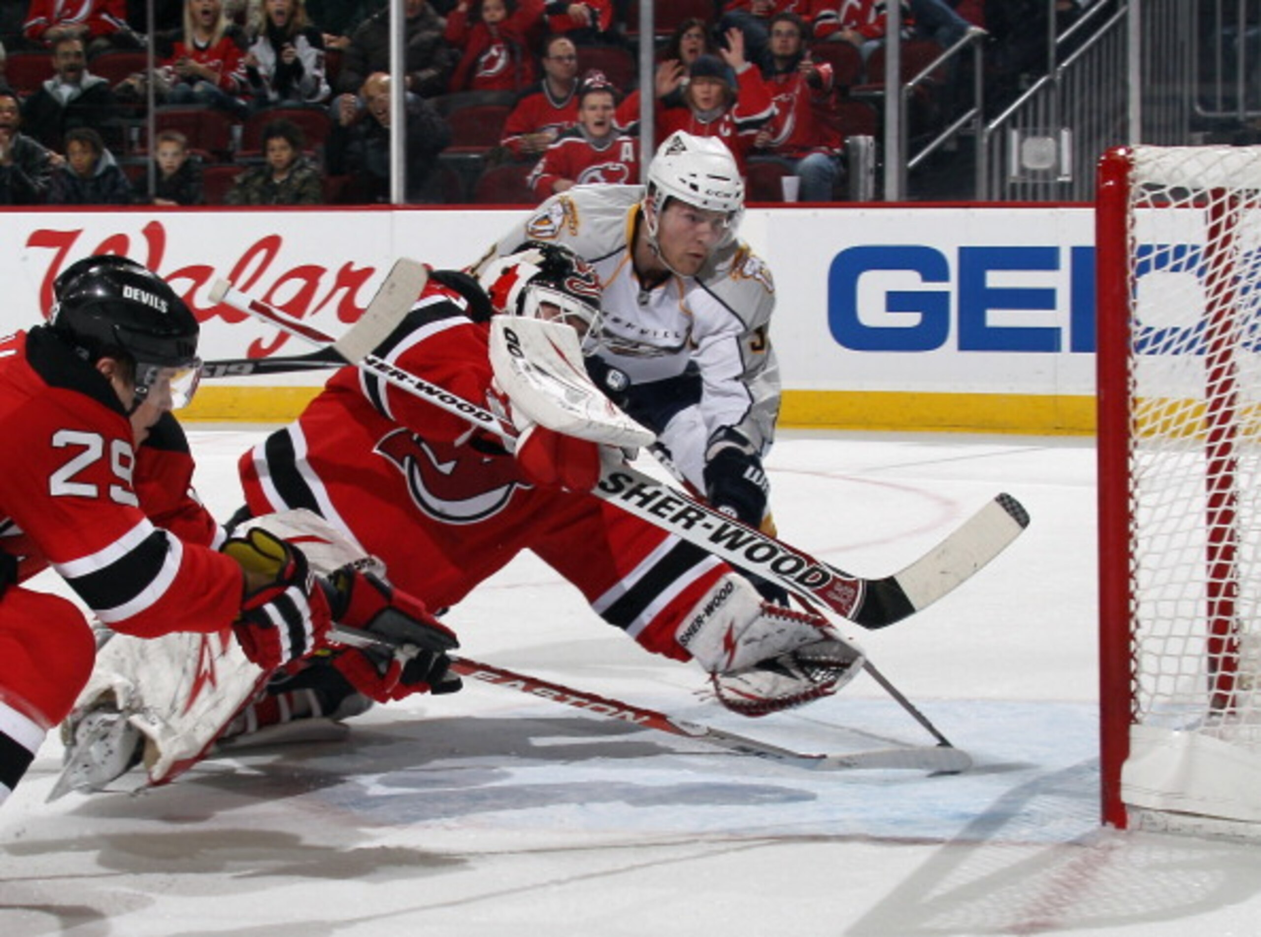 NEWARK, NJ - DECEMBER 17: Colin Wilson #33 of the Nashville Predators watches a shot by Shea Weber #6 elude Martin Brodeur #30 of the New Jersey Devils at 19:33 of the first period at the Prudential Center on December 17, 2010 in Newark, New Jersey.  (Pho