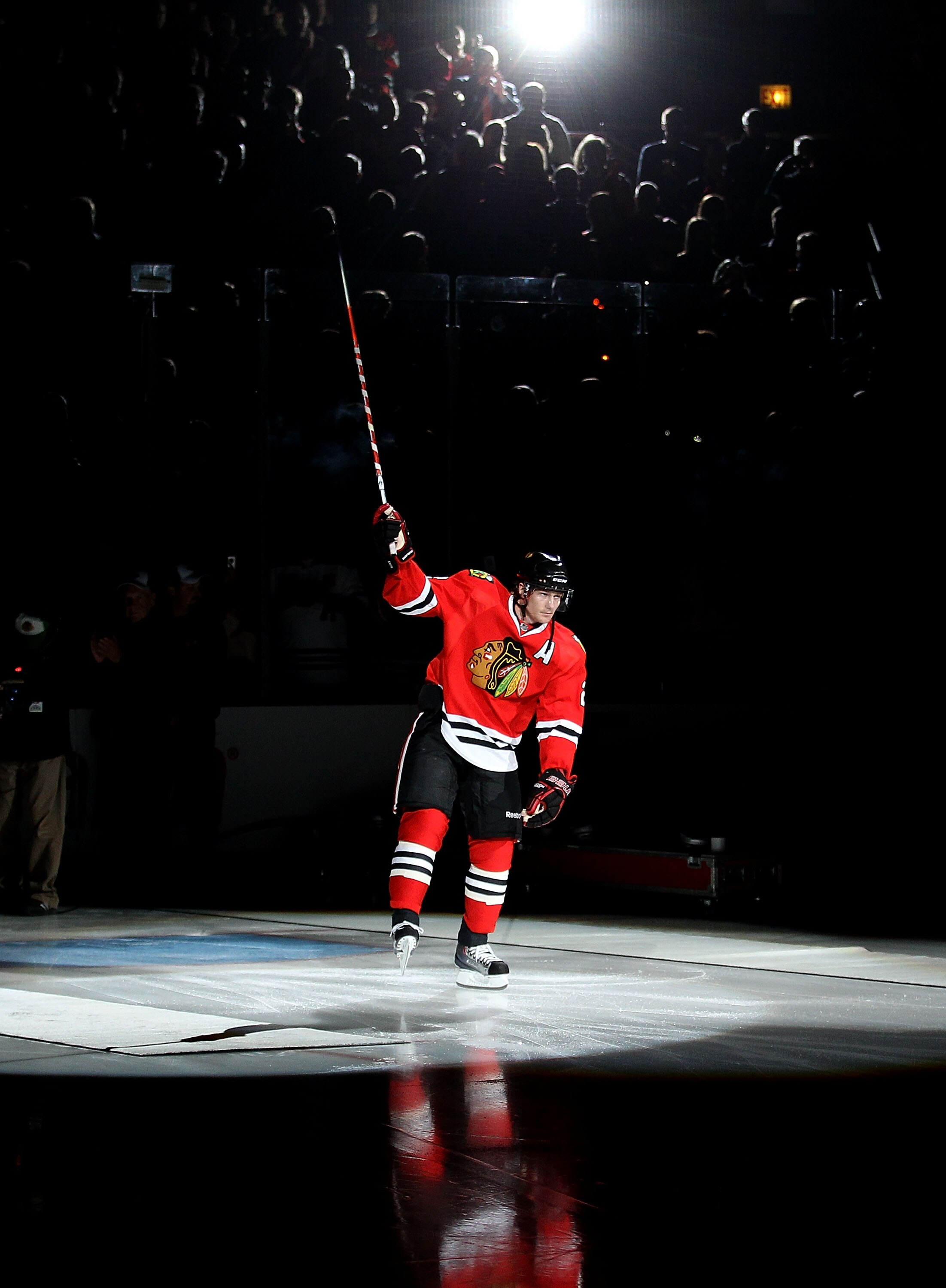 CHICAGO - OCTOBER 09: Duncan Keith #2 of the Chicago Blackhawks skates onto the ice during a ceremony before the Blackhawks season home opening game against the Detroit Red Wings at the United Center on October 9, 2010 in Chicago, Illinois. (Photo by Jona