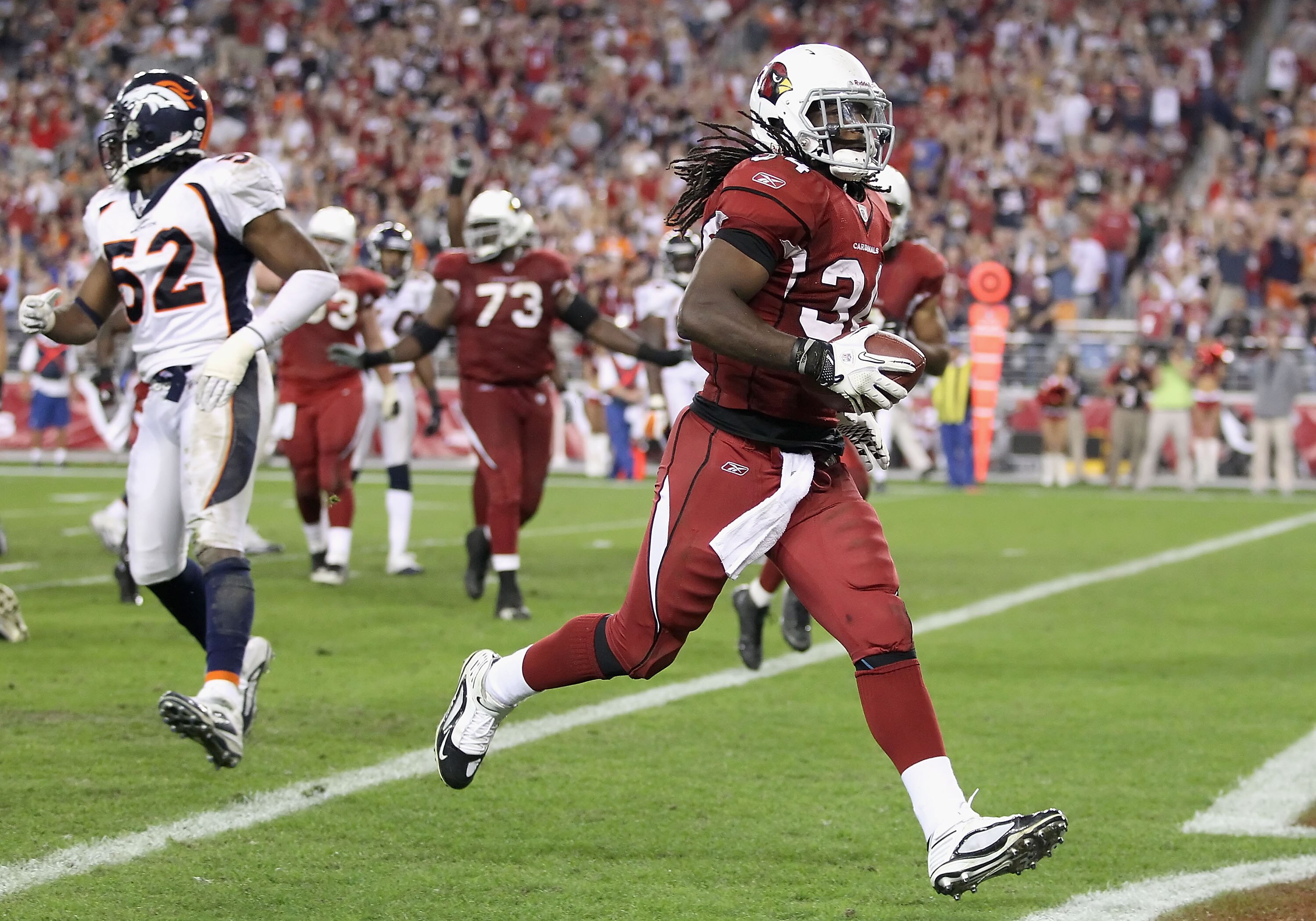 GLENDALE, AZ - DECEMBER 12:  Runningback Tim Hightower #34 of the Arizona Cardinals scores a 8 yard rushing touchdown against the Denver Broncos during the fourth quarter of the NFL game at the University of Phoenix Stadium on December 12, 2010 in Glendal