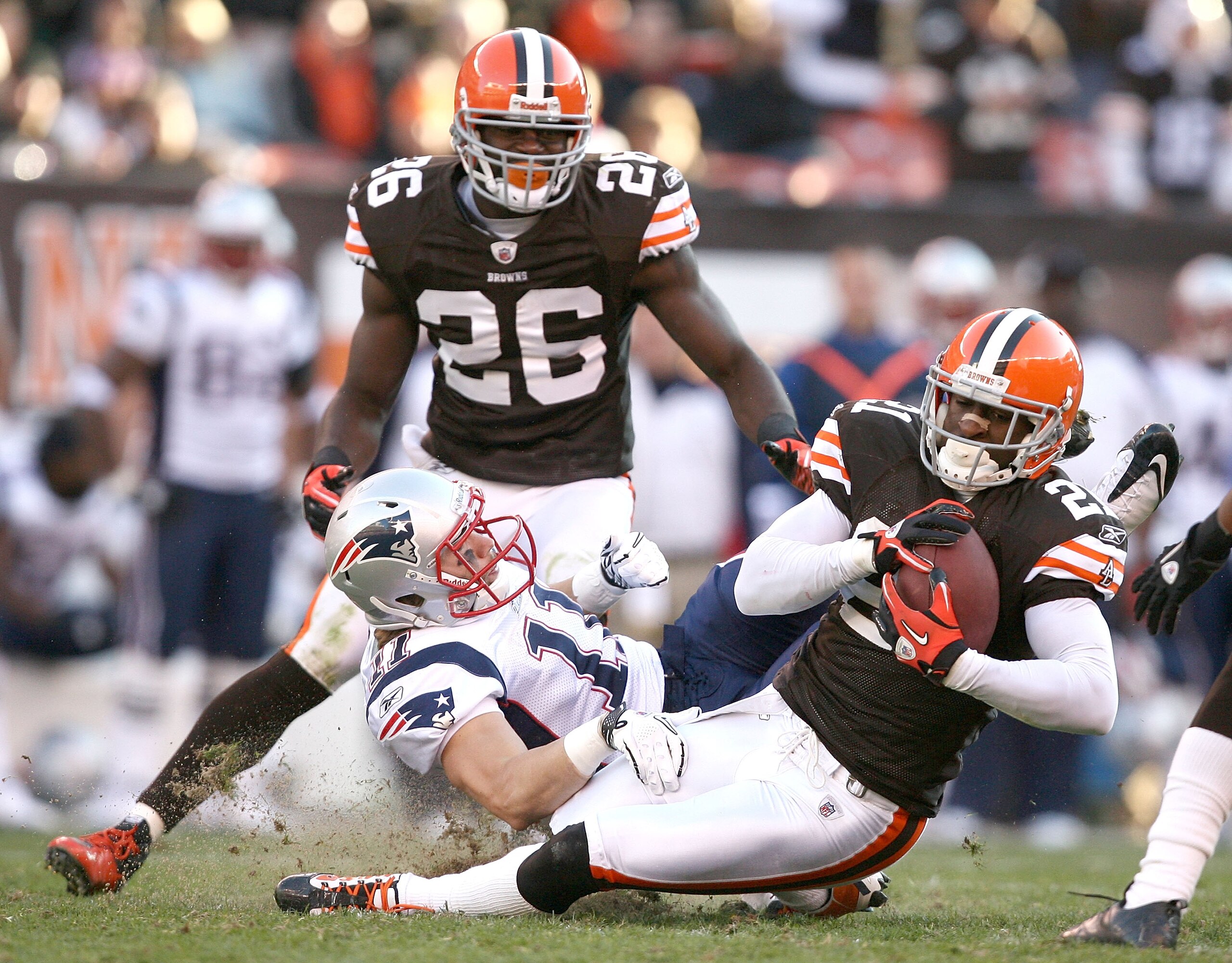 CLEVELAND - NOVEMBER 07: Defensive back Abram Elam #26 of the Cleveland Browns watches as Eric Wright #21 intercepts the ball in front of wide receiver Julian Edelman #11 of the New England Patriots at Cleveland Browns Stadium on November 7, 2010 in Clev CLEVELAND - NOVEMBER 07: Defensive back Abram Elam #26 of the Cleveland Browns watches as Eric Wright #21 intercepts the ball in front of wide receiver Julian Edelman #11 of the New England Patriots at Cleveland Browns Stadium on November 7, 2010 in Clev