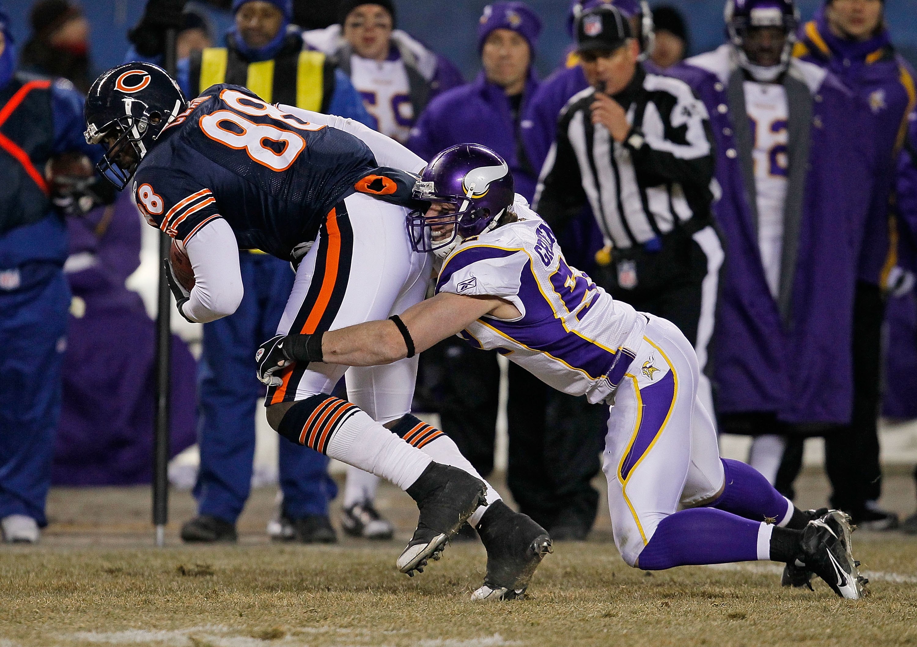 CHICAGO - DECEMBER 28: Desmond Clark #88 of the Chicago Bears tries to break away from Chad Greenway #52 of the Minnesota Vikings at Soldier Field on December 28, 2009 in Chicago, Illinois. The Bears defeated the Vikings 36-30 in overtime. (Photo by Jonat