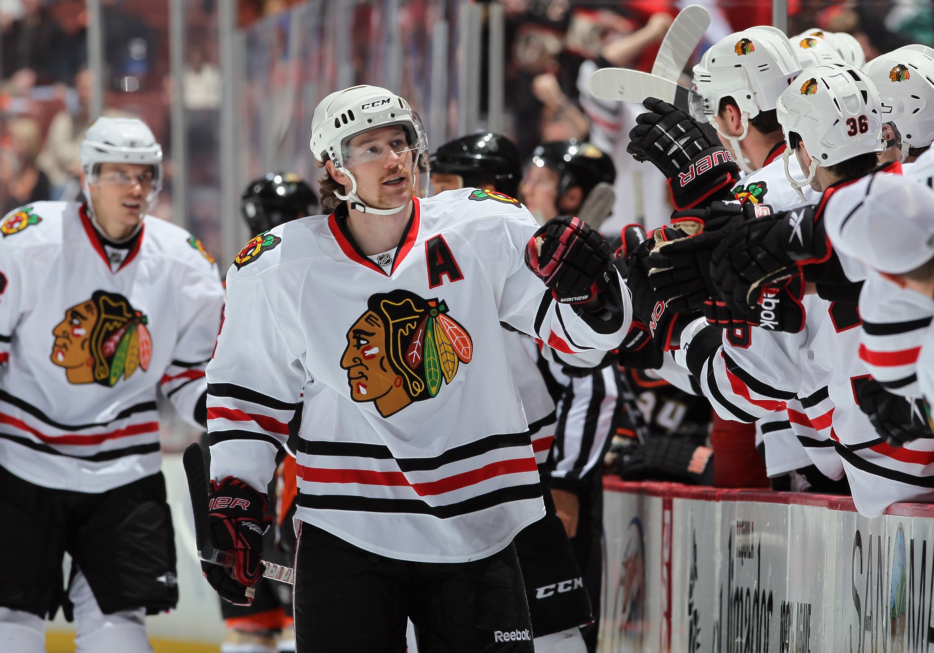 ANAHEIM, CA - NOVEMBER 26:  Duncan Keith #2 of the Chicago Blackhawks receives high fives from the bench against the Anaheim Ducks at the Honda Center on November 26, 2010 in Anaheim, California.  (Photo by Jeff Gross/Getty Images)