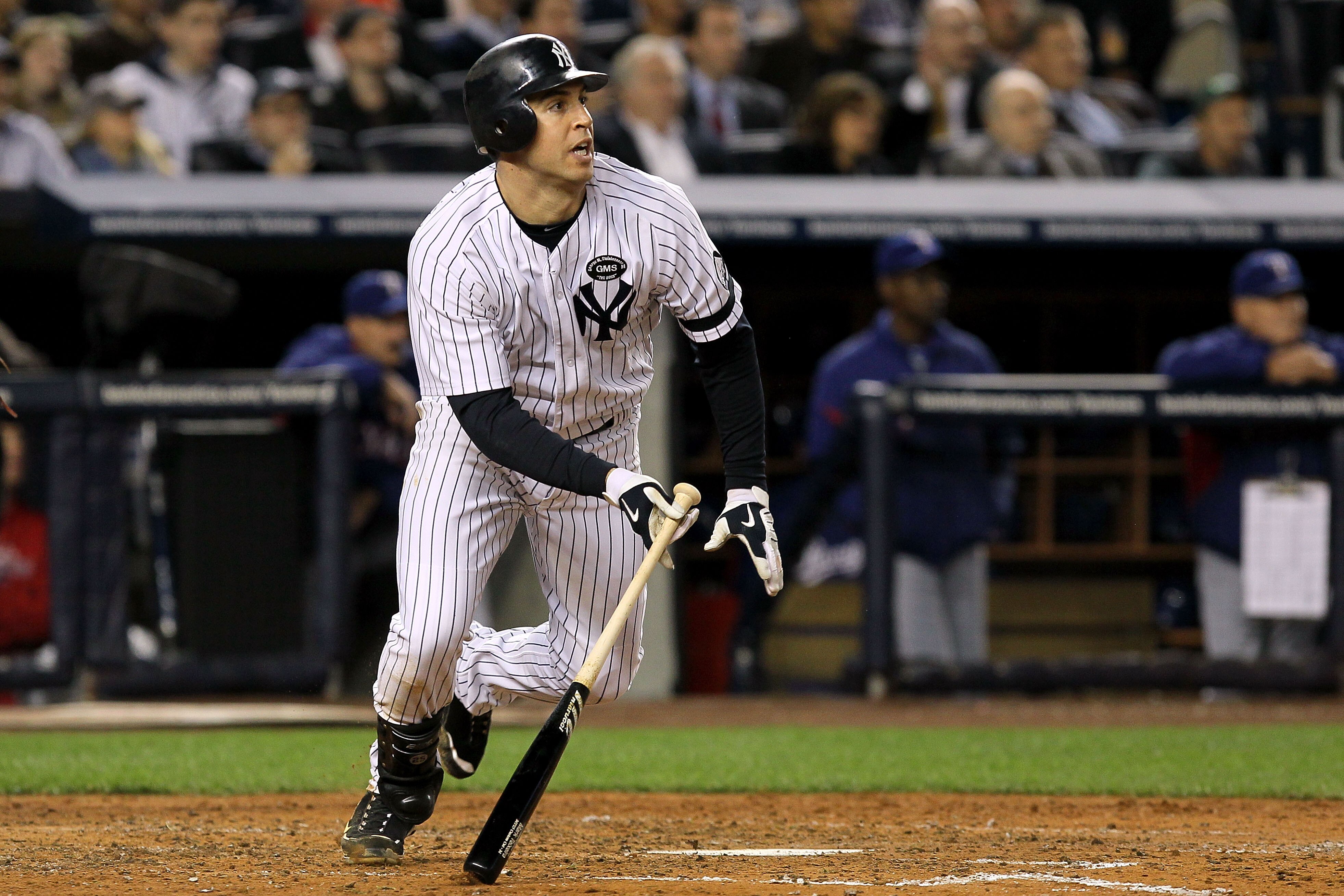 NEW YORK - OCTOBER 19:  Mark Teixeira #25 of the New York Yankees bats against the Texas Rangers in Game Four of the ALCS during the 2010 MLB Playoffs at Yankee Stadium on October 19, 2010 in the Bronx borough of New York City. The Rangers won 10-3.  (Pho