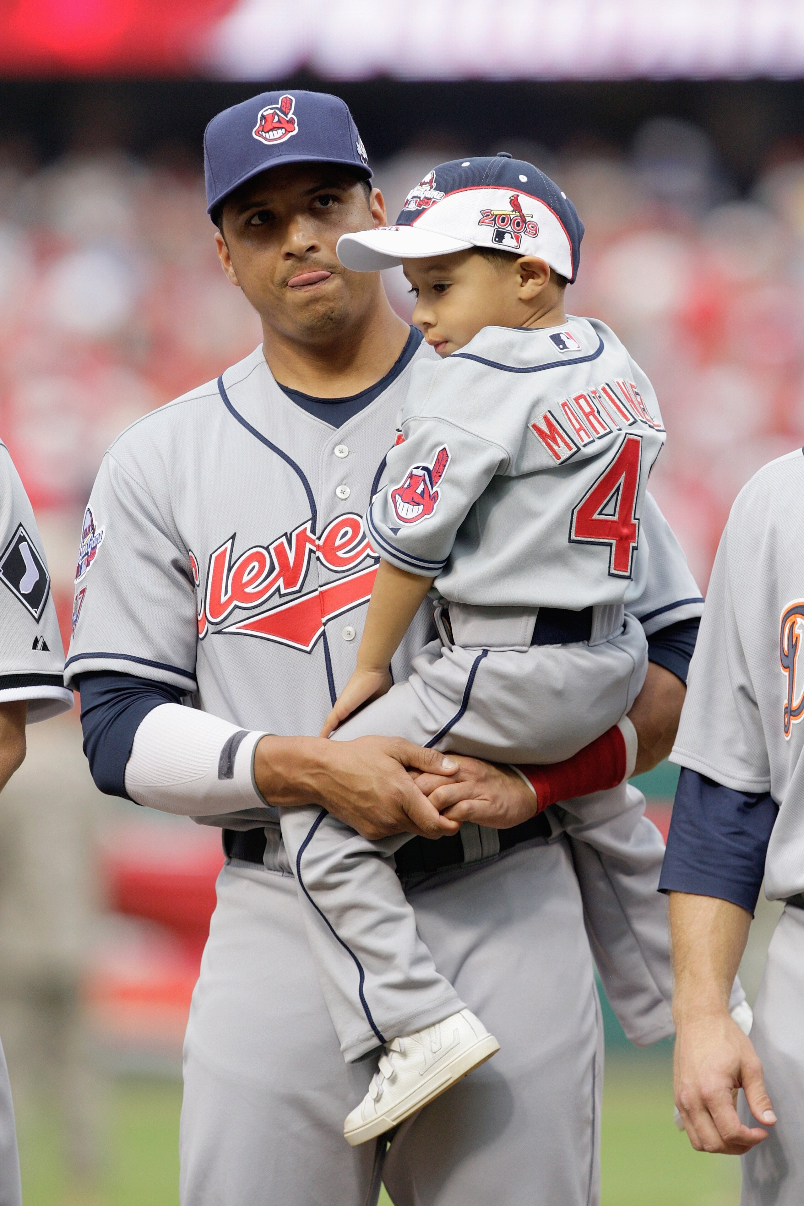 ST. LOUIS, MO - JULY 14: American League All-Star Victor Martinez of Cleveland Indians stands with his son during the lineup before the 2009 MLB All-Star Game at Busch Stadium on July 14, 2009 in St Louis, Missouri. (Photo by Pool/Getty Images)