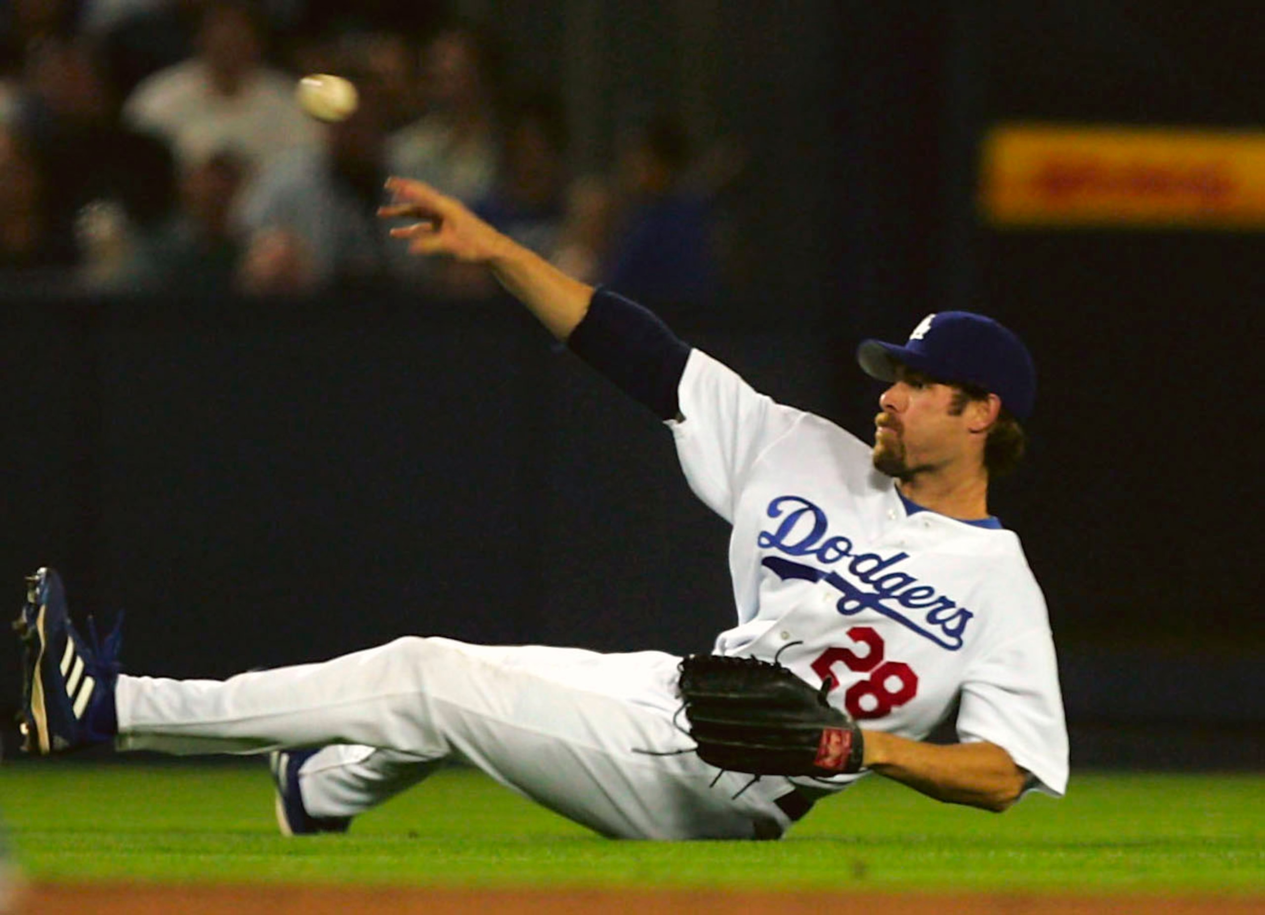 LOS ANGELES - SEPTEMBER 29:  Left fielder Jayson Werth #28 of the Los Angeles Dodgers throws to third but can't get Luis Gonzalez of the Arizona Diamondbacks after diving for a single by Chad Tracy on September 29, 2005 at Dodger Stadium in Los Angeles, C